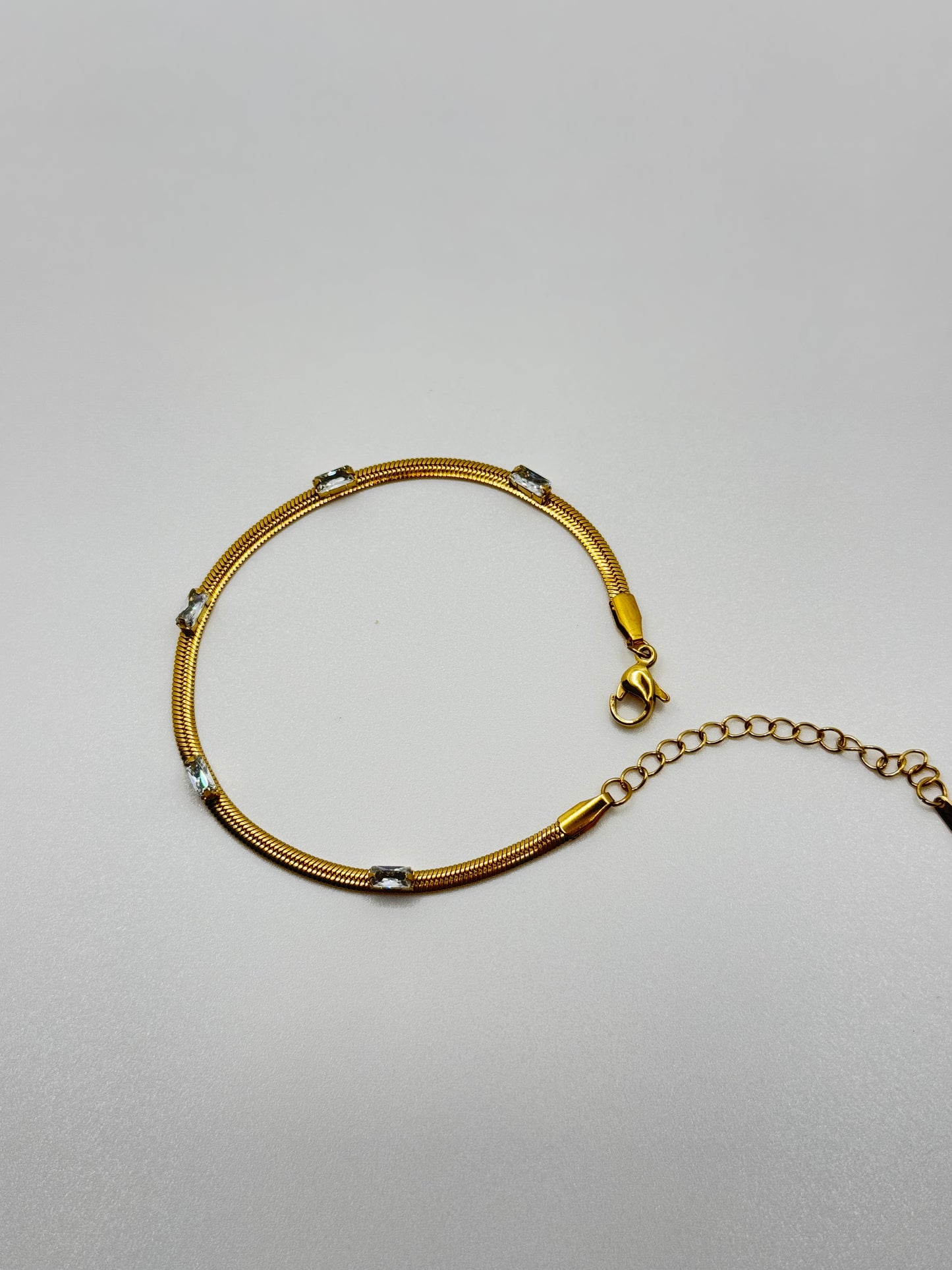 Gold Tone Snake Chain Bracelet with Crystal Accents