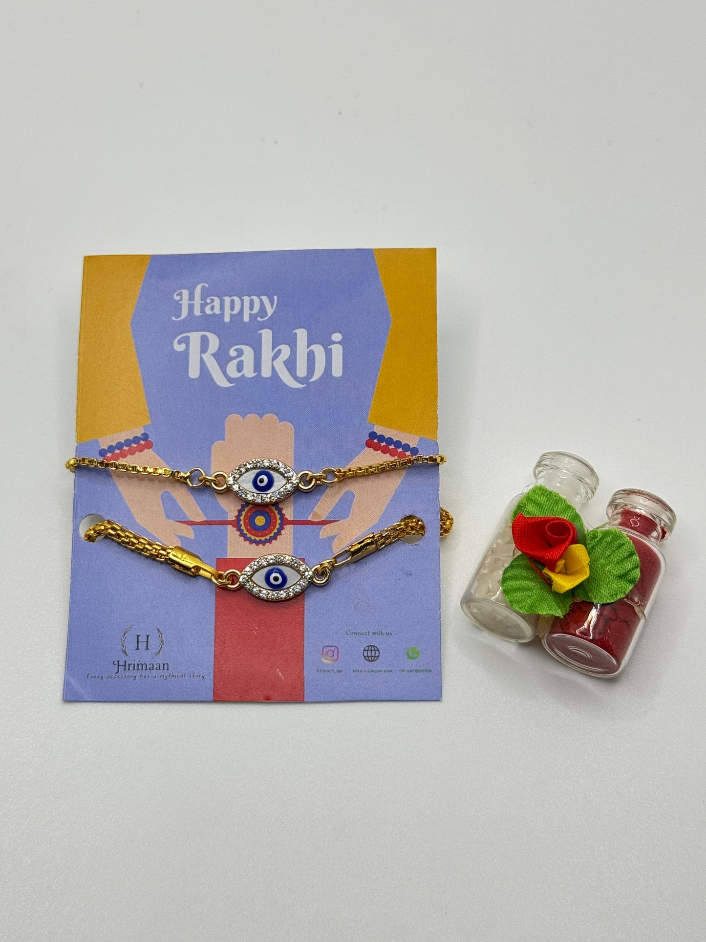 Evil Eye Duo Charm Rakhi for Bhaiya bhabhi with kumkum and rice– Gold-Toned Protection Set