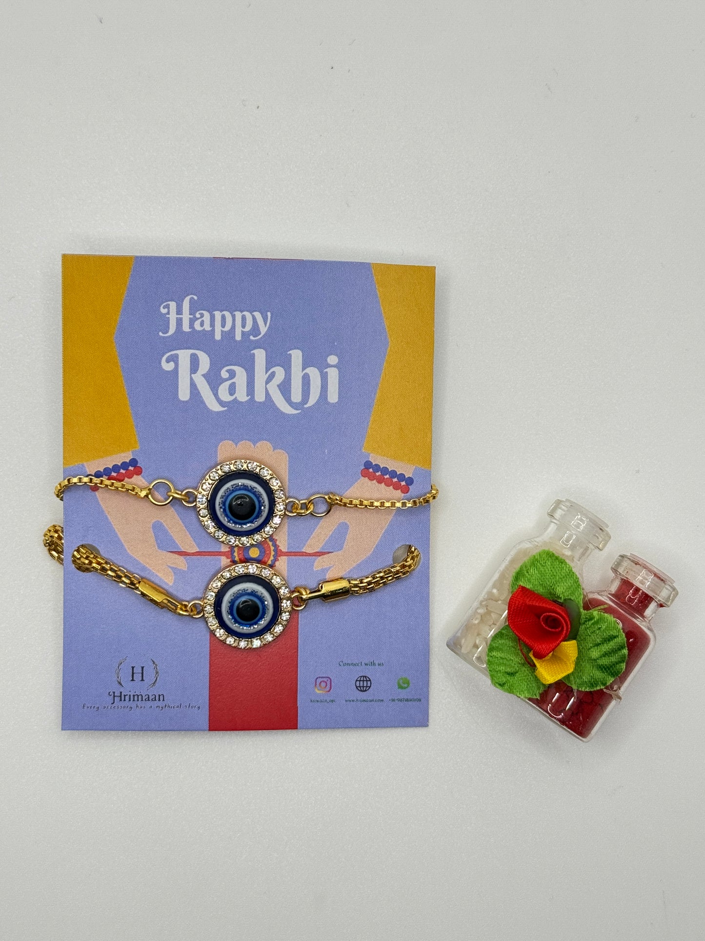 Evil Eye Duo Charm Rakhi for Bhaiya bhabhi with kumkum and rice– Gold-Toned Protection Set