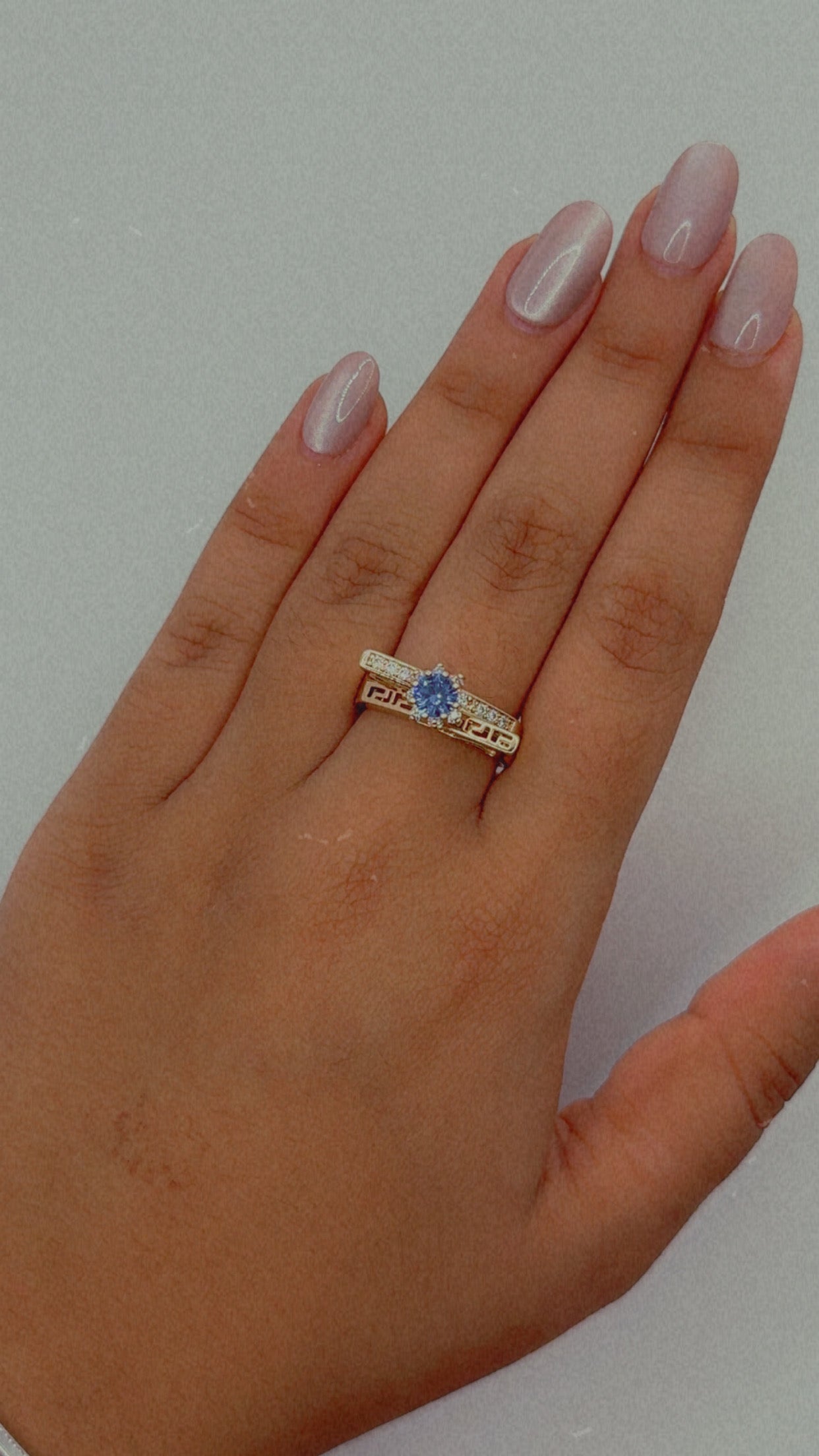 Gold Tone Ring with Blue Stone and Geometric Detail