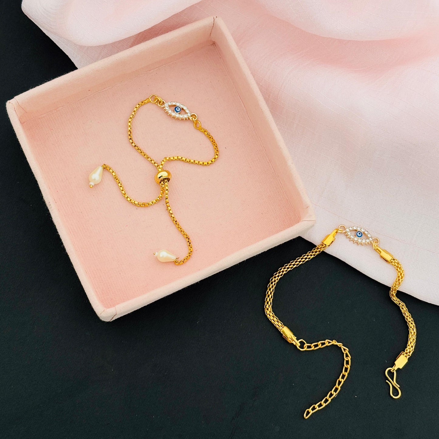 Evil Eye Duo Charm Rakhi for Bhaiya bhabhi with kumkum and rice– Gold-Toned Protection Set