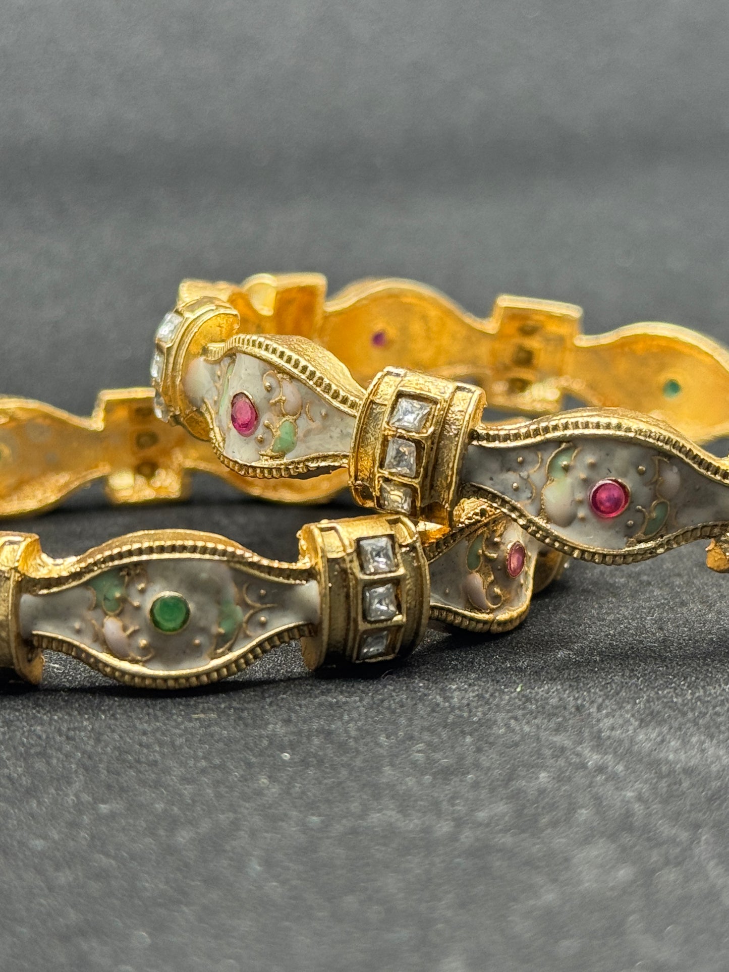 Striking Gold Bracelet with Ornate Reliefs and Gemstone Inlays 2*8