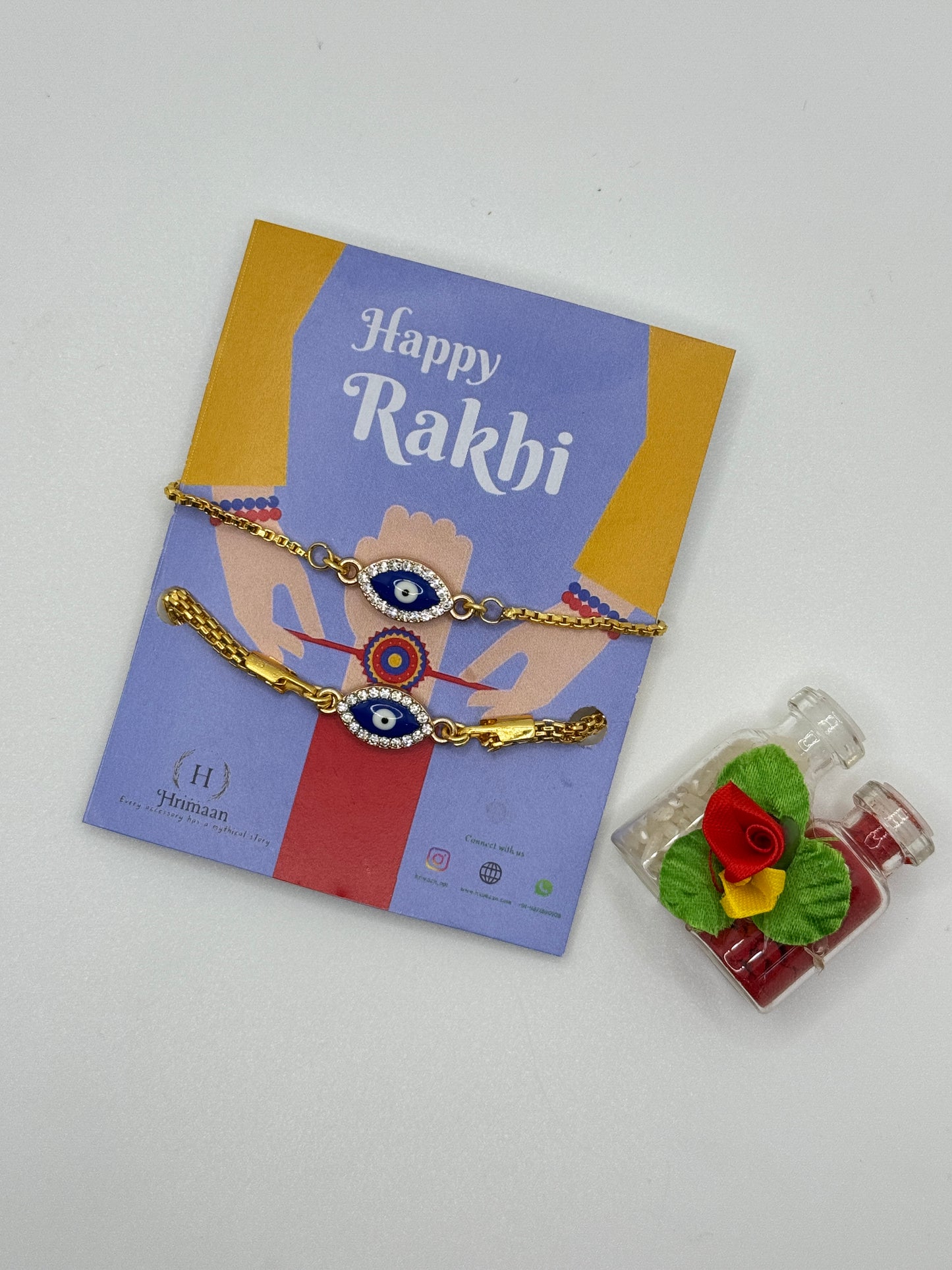 Evil Eye Duo Charm Rakhi for Bhaiya bhabhi with kumkum and rice– Gold-Toned Protection Set