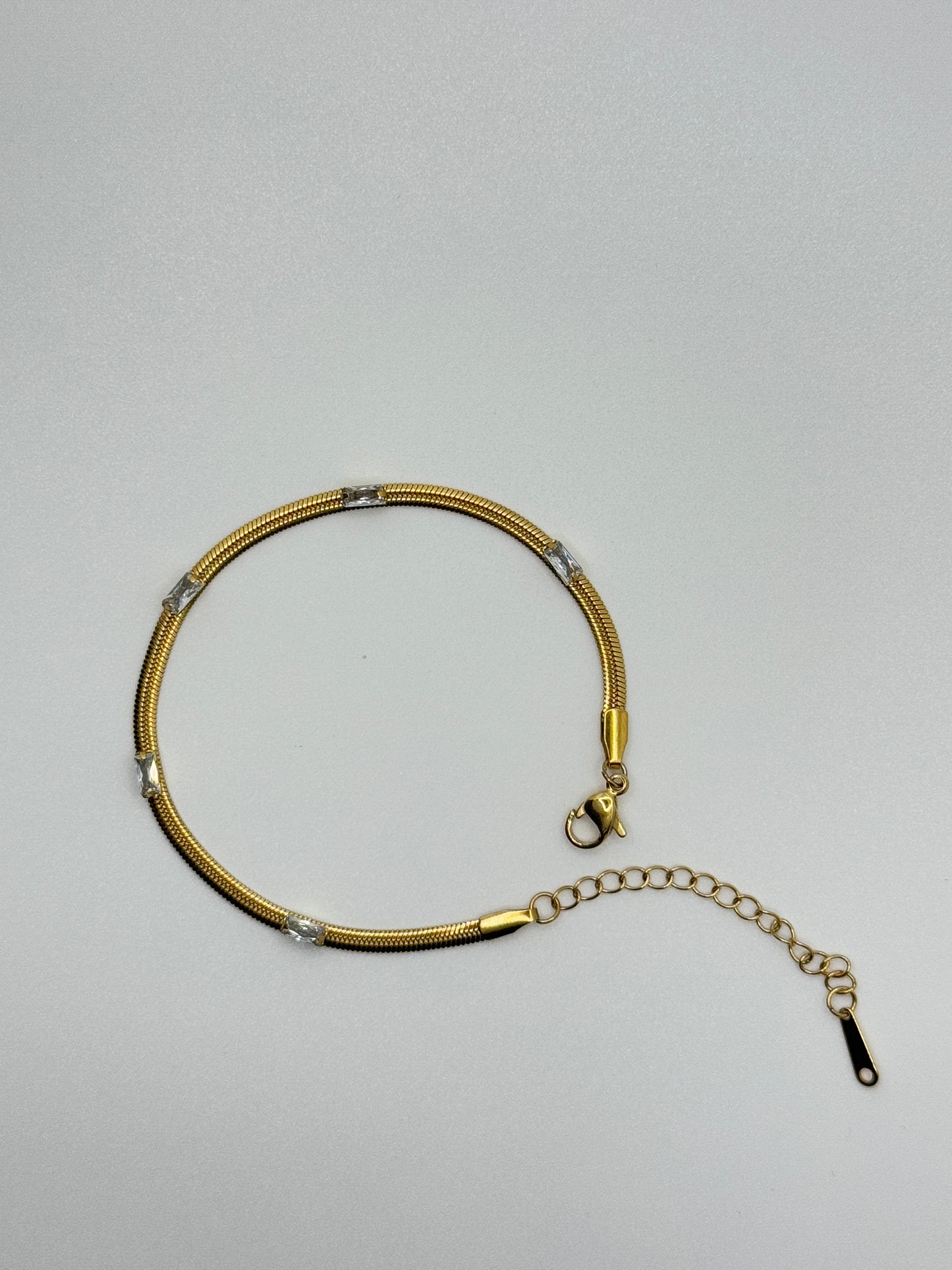 Gold Tone Snake Chain Bracelet with Crystal Accents