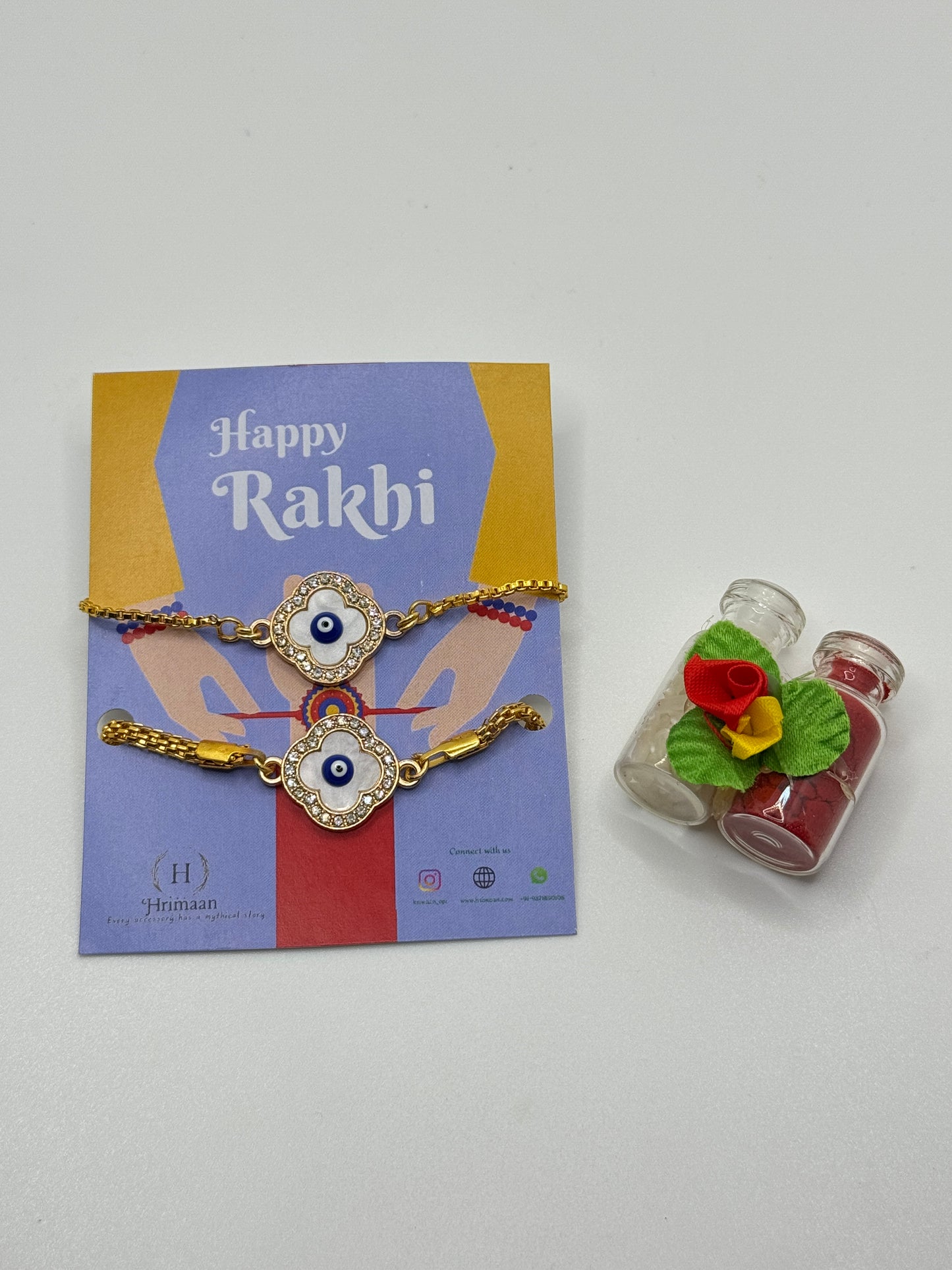 Evil Eye Duo Charm Rakhi for Bhaiya bhabhi with kumkum and rice– Gold-Toned Protection Set