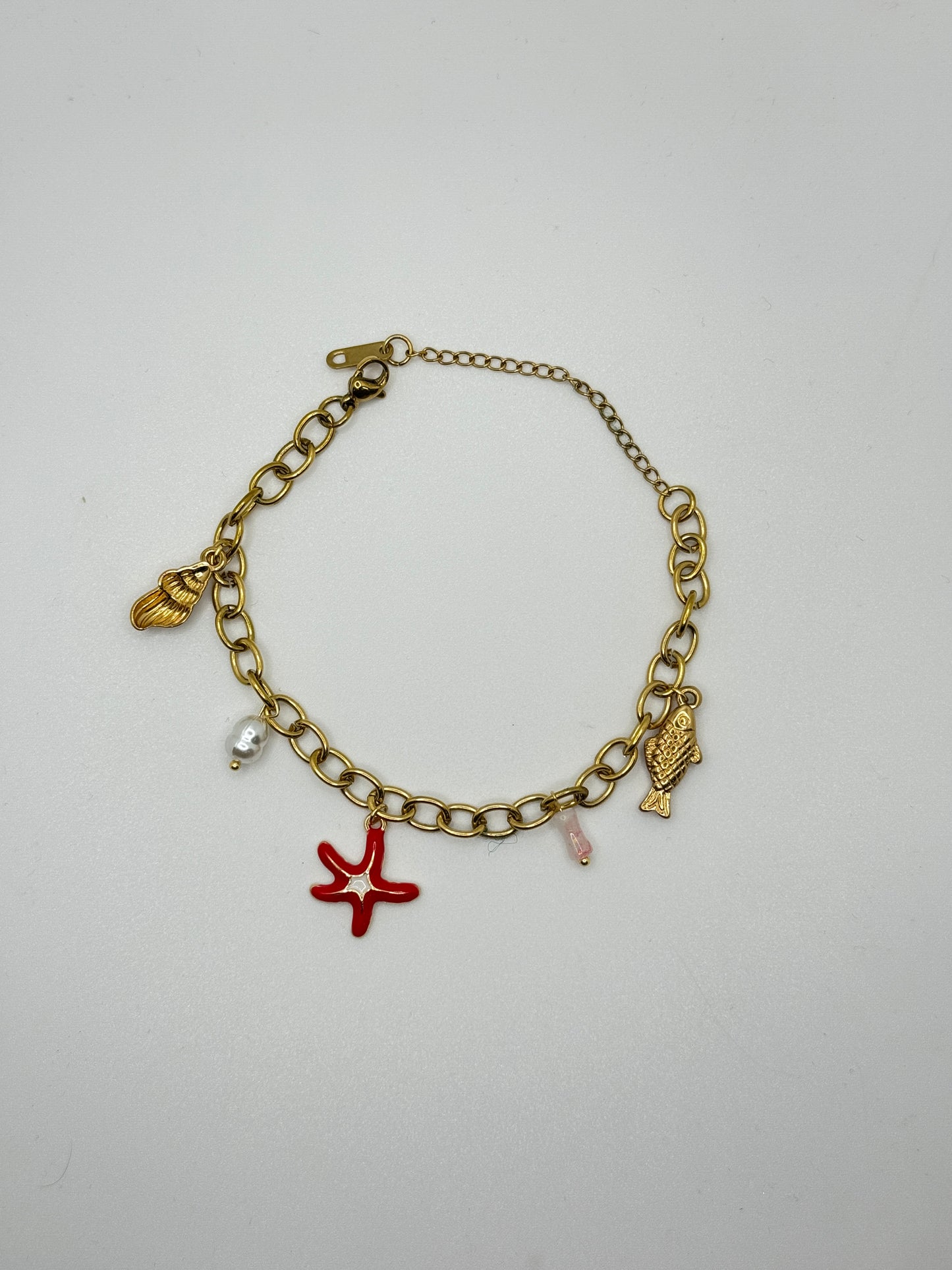 Gold Charm Bracelet with a Red Starfish, Fish, and Shells