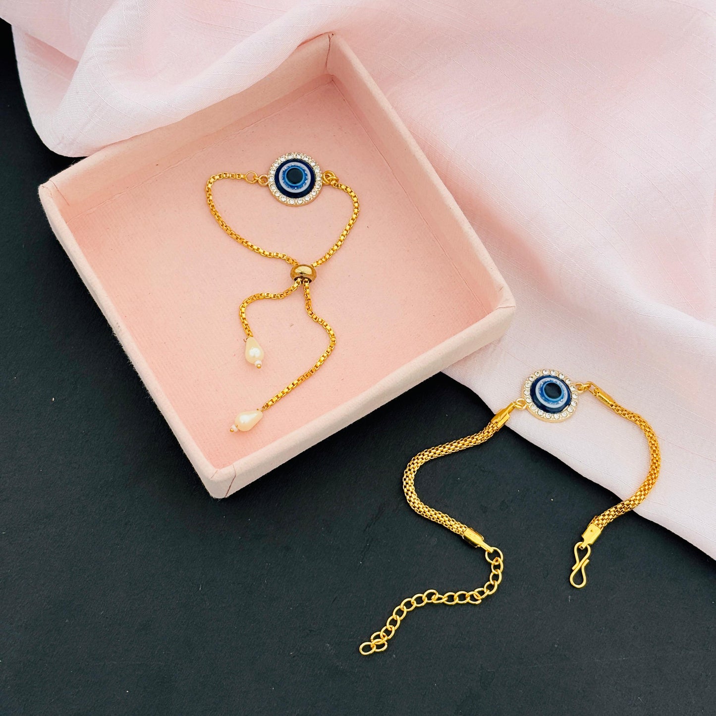 Evil Eye Duo Charm Rakhi for Bhaiya bhabhi with kumkum and rice– Gold-Toned Protection Set