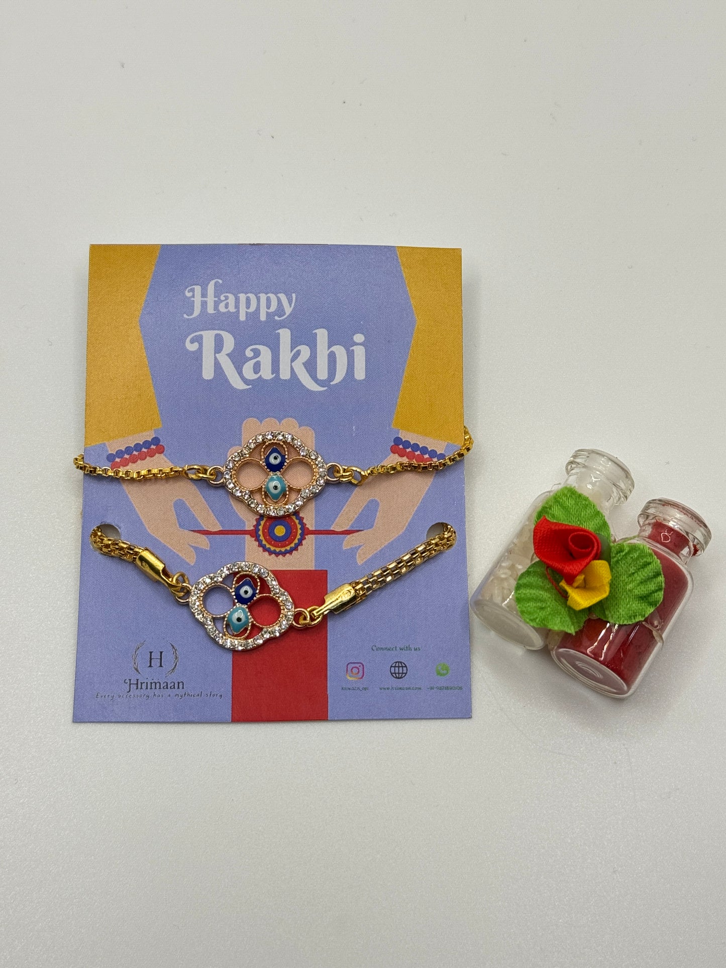 Evil Eye Duo Charm Rakhi for Bhaiya bhabhi with kumkum and rice– Gold-Toned Protection Set