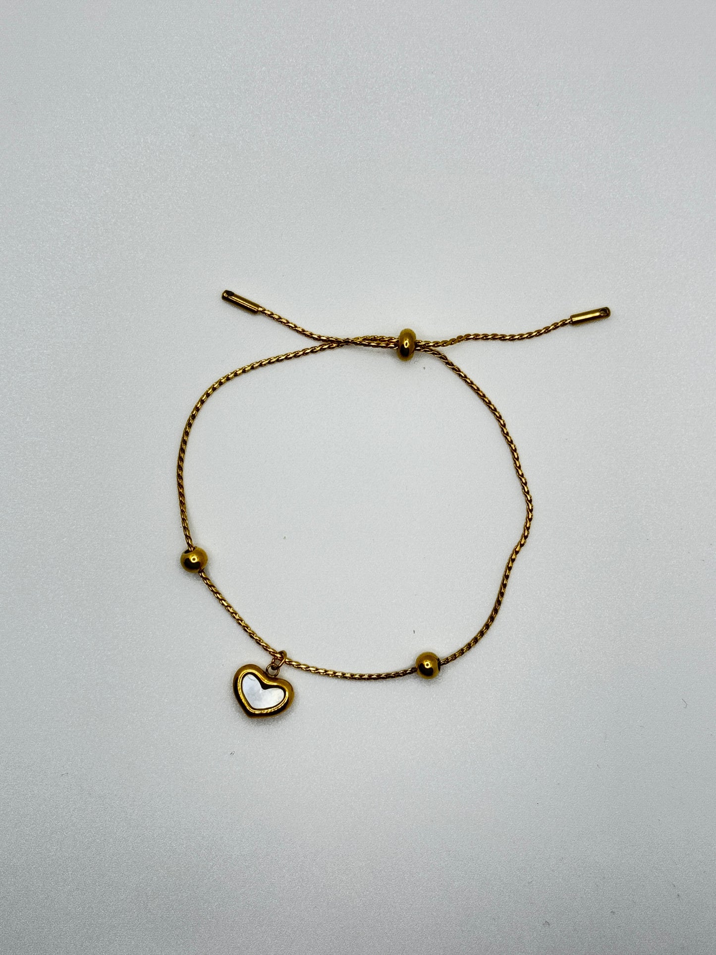 Gold Tone Adjustable Bracelet with Mother-of-Pearl Heart
