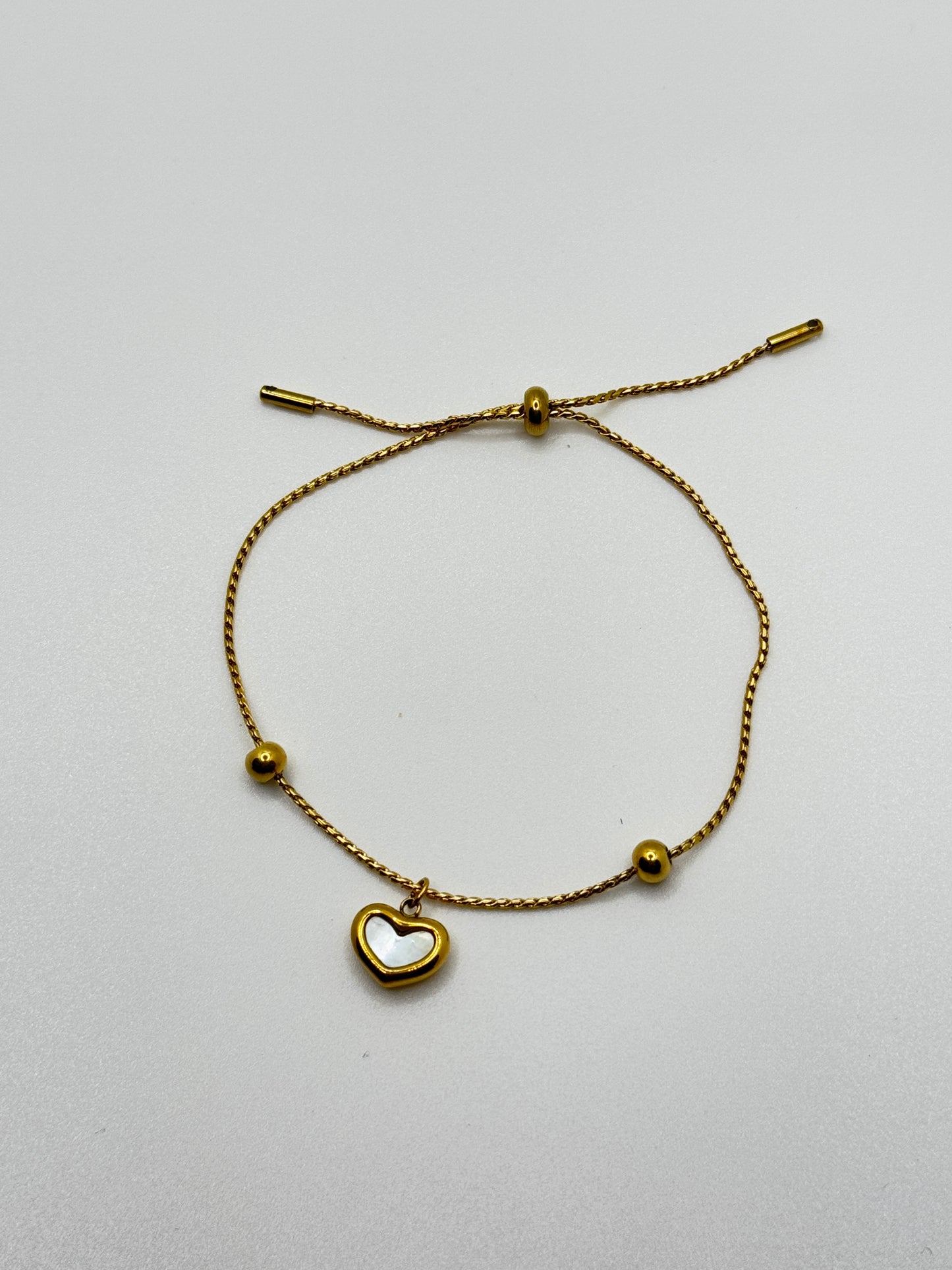 Gold Tone Adjustable Bracelet with Mother-of-Pearl Heart