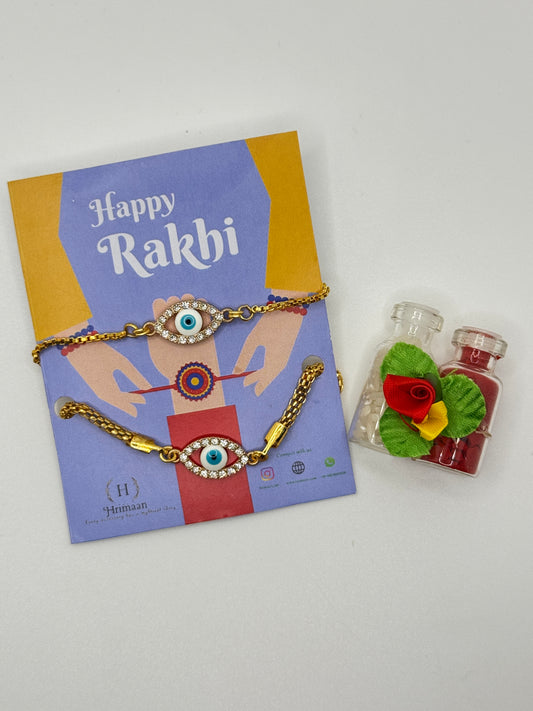 Evil Eye Duo Charm Rakhi for Bhaiya bhabhi  with kumkum and rice– Gold-Toned Protection Set