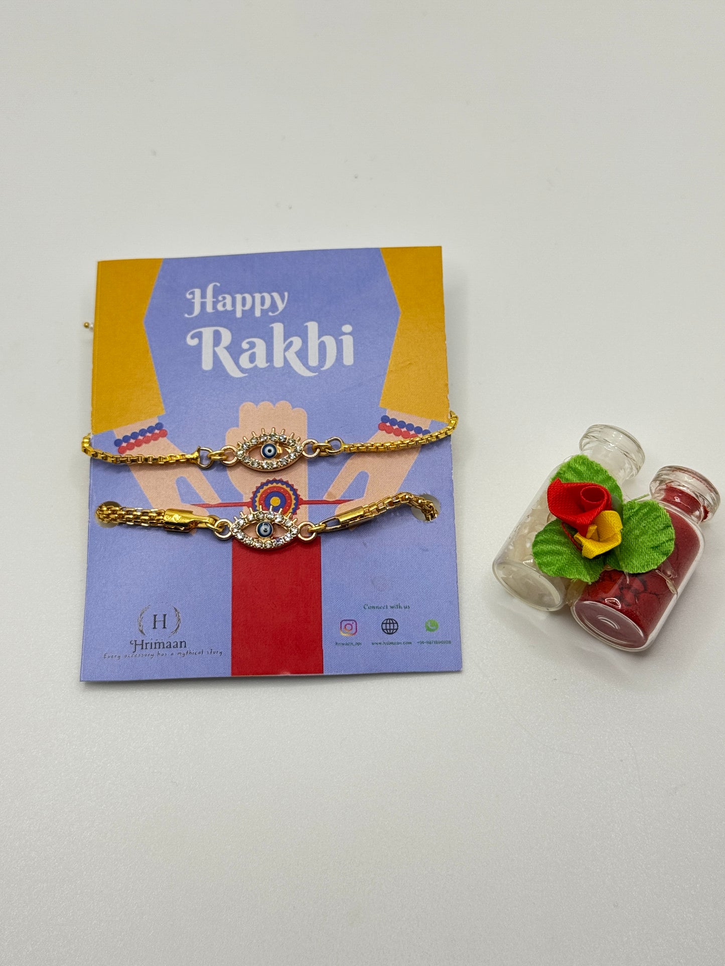 Evil Eye Duo Charm Rakhi for Bhaiya bhabhi  with kumkum and rice– Gold-Toned Protection Set