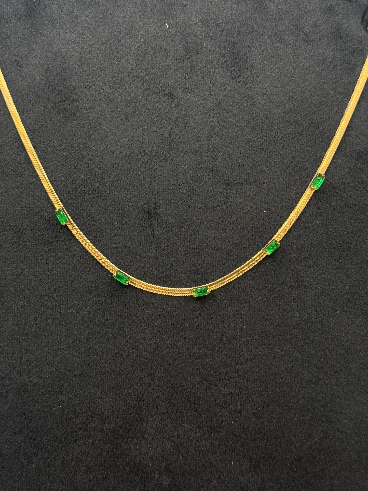 Gold Tone Snake Chain Necklace with Emerald Green Baguette Accents