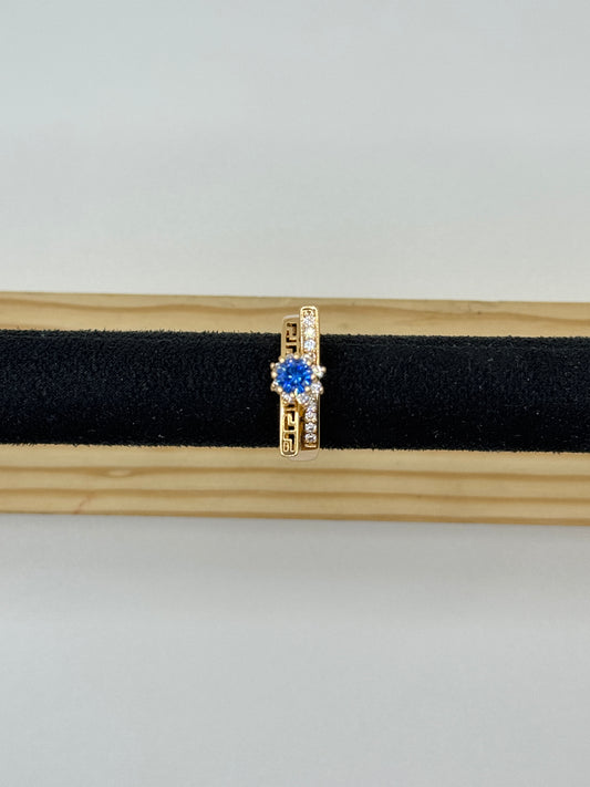 Gold Tone Ring with Blue Stone and Geometric Detail