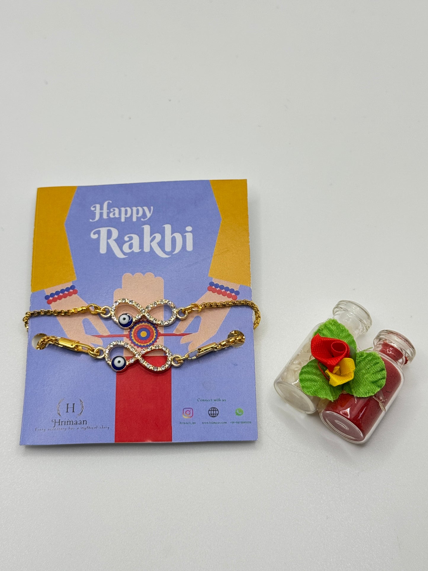 Evil Eye Duo Charm Rakhi for Bhaiya bhabhi  with kumkum and rice– Gold-Toned Protection Set
