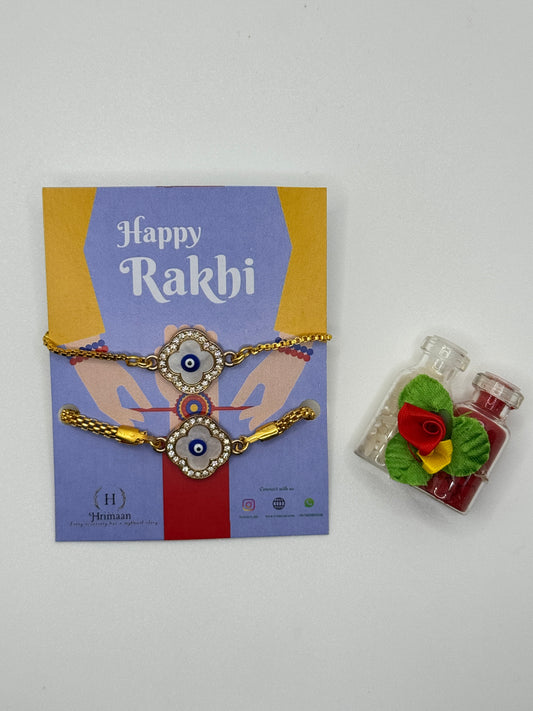 Evil Eye Duo Charm Rakhi for Bhaiya bhabhi  with kumkum and rice– Gold-Toned Protection Set