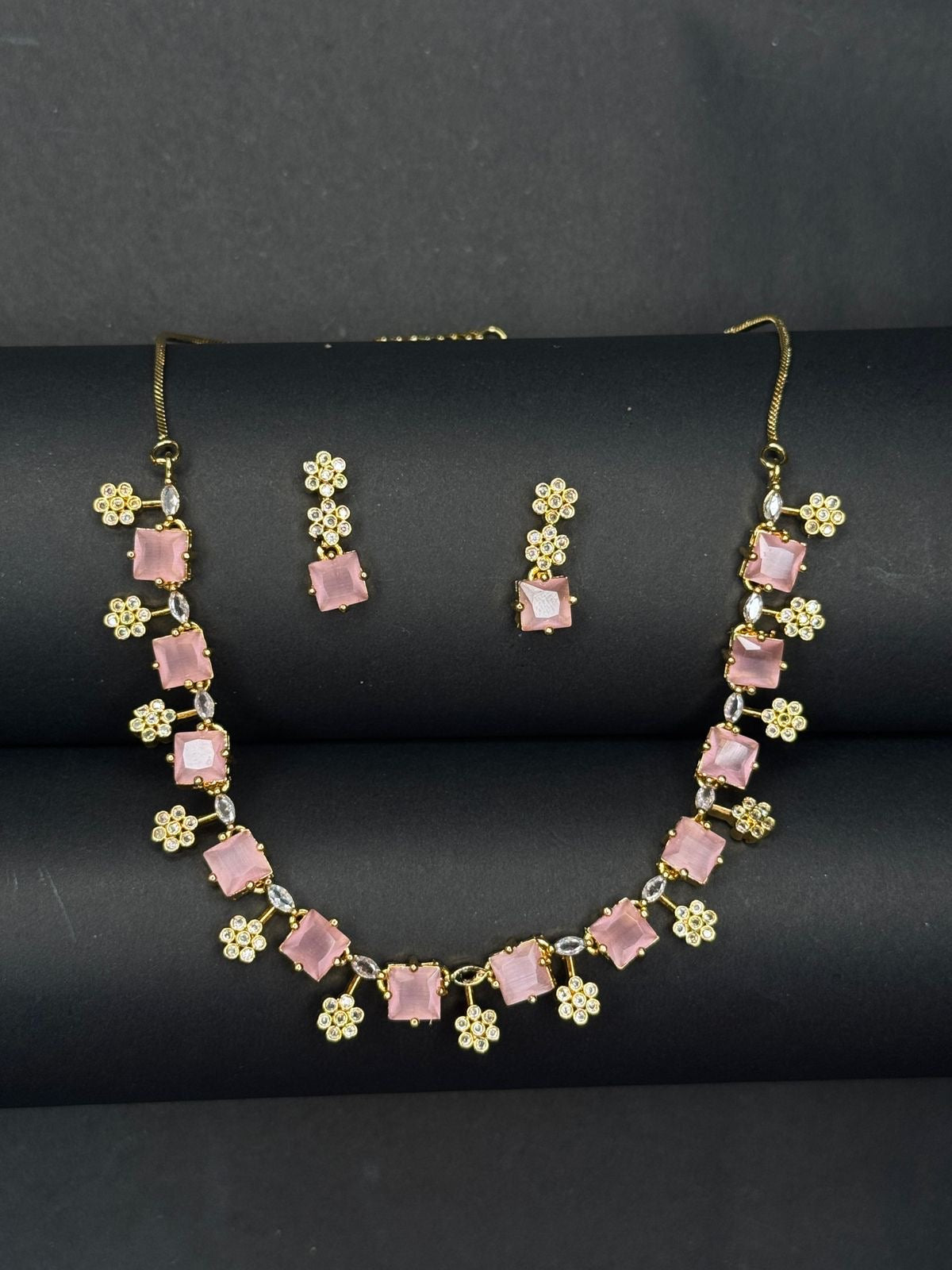 Necklace with square baby pink stones and floral accents