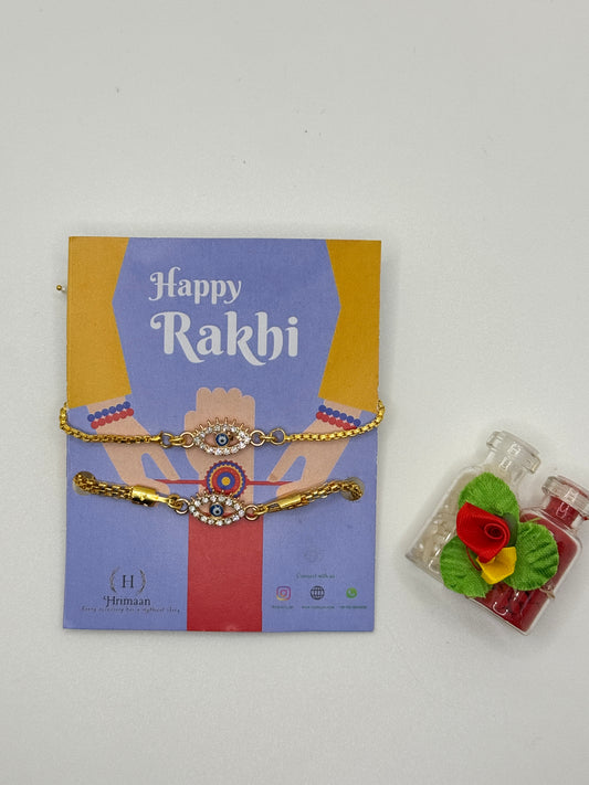 Evil Eye Duo Charm Rakhi for Bhaiya bhabhi  with kumkum and rice– Gold-Toned Protection Set