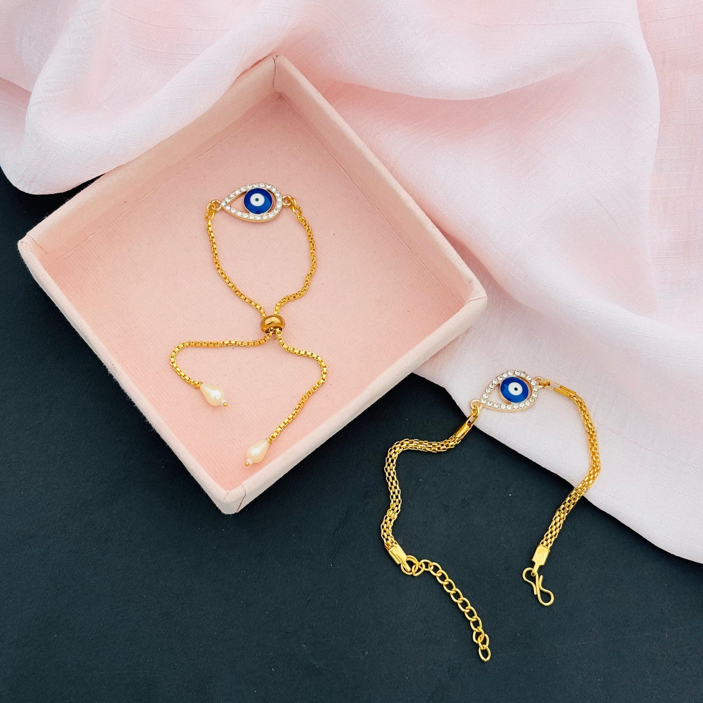 Evil Eye Duo Charm Rakhi for Bhaiya bhabhi  with kumkum and rice– Gold-Toned Protection Set