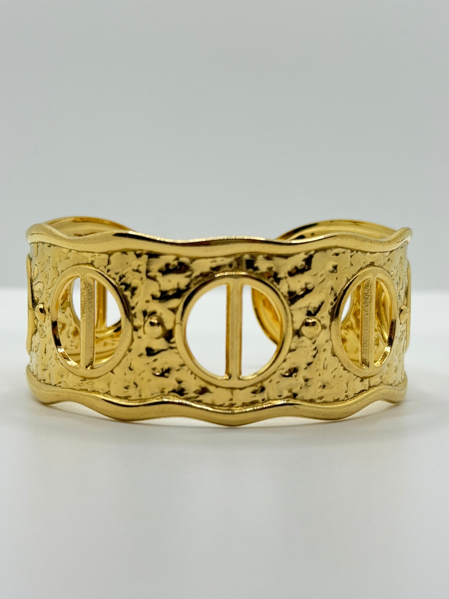 Ornate Gold Cuff Bracelet with Circular Cut-Outs