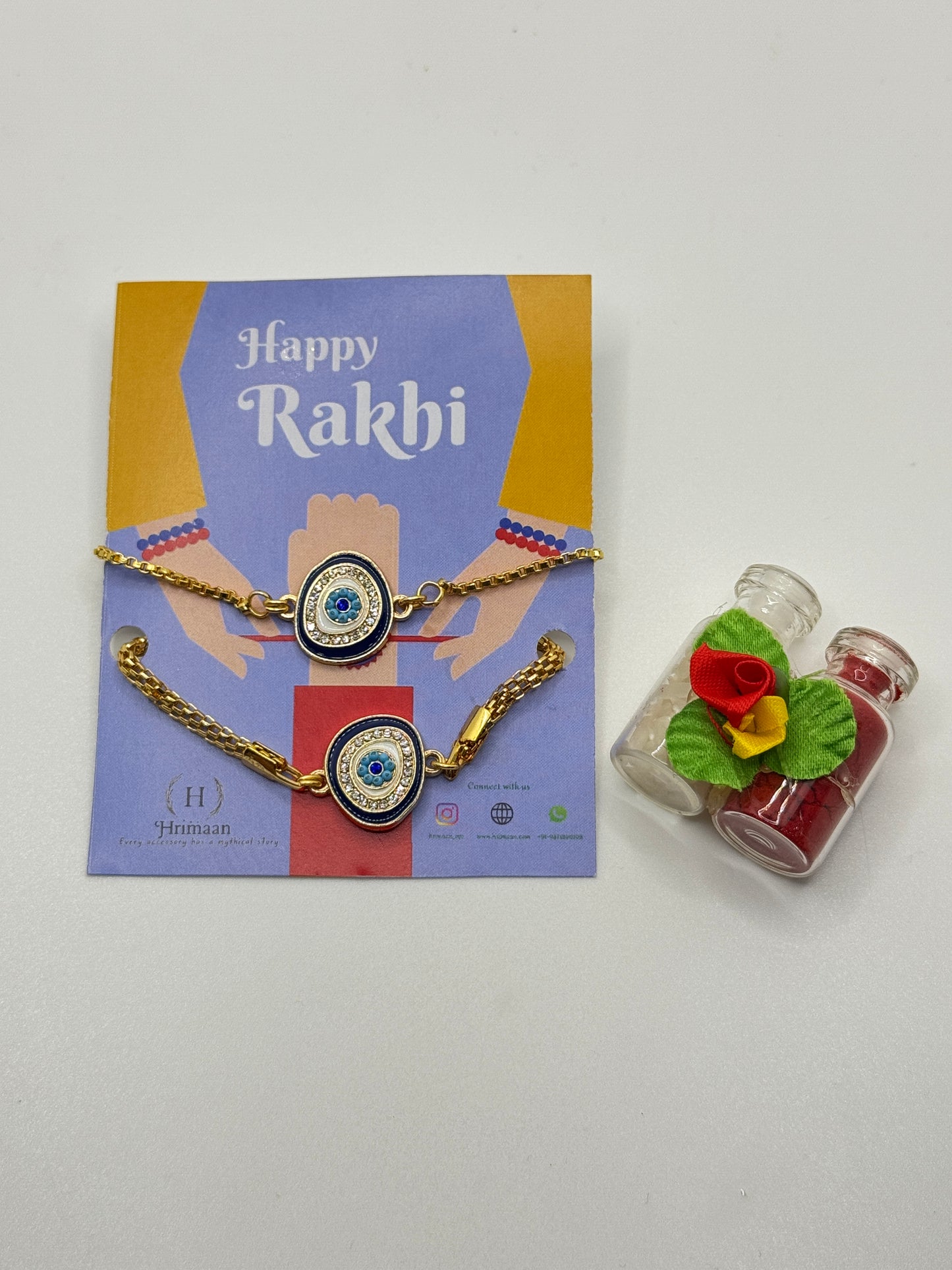 Evil Eye Duo Charm Rakhi for Bhaiya bhabhi  with kumkum and rice– Gold-Toned Protection Set