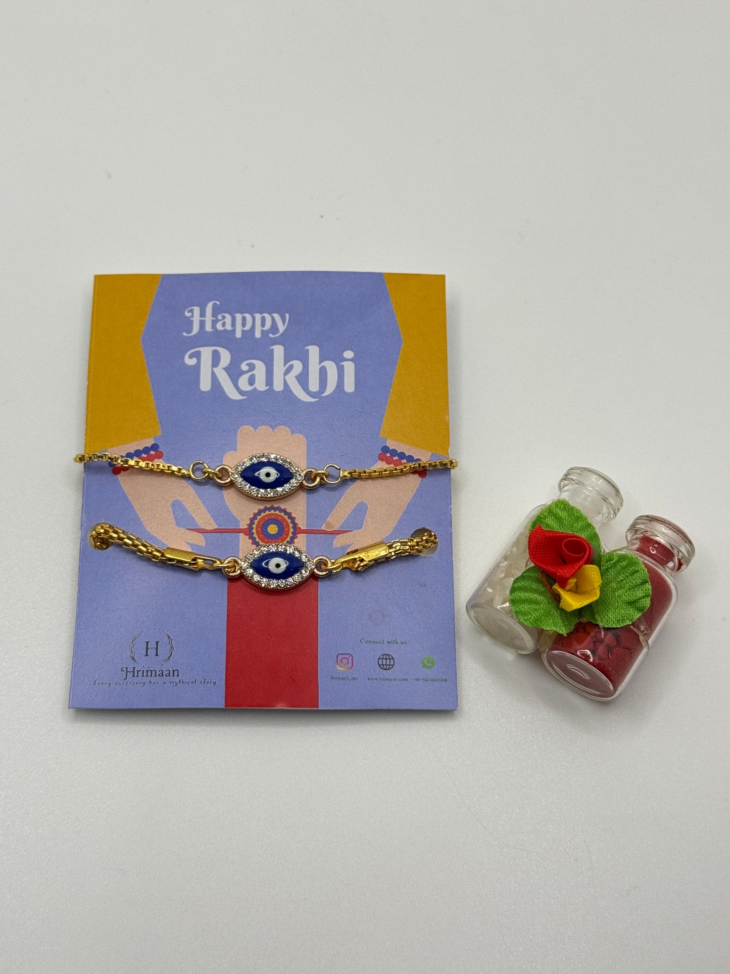 Evil Eye Duo Charm Rakhi for Bhaiya bhabhi  with kumkum and rice– Gold-Toned Protection Set