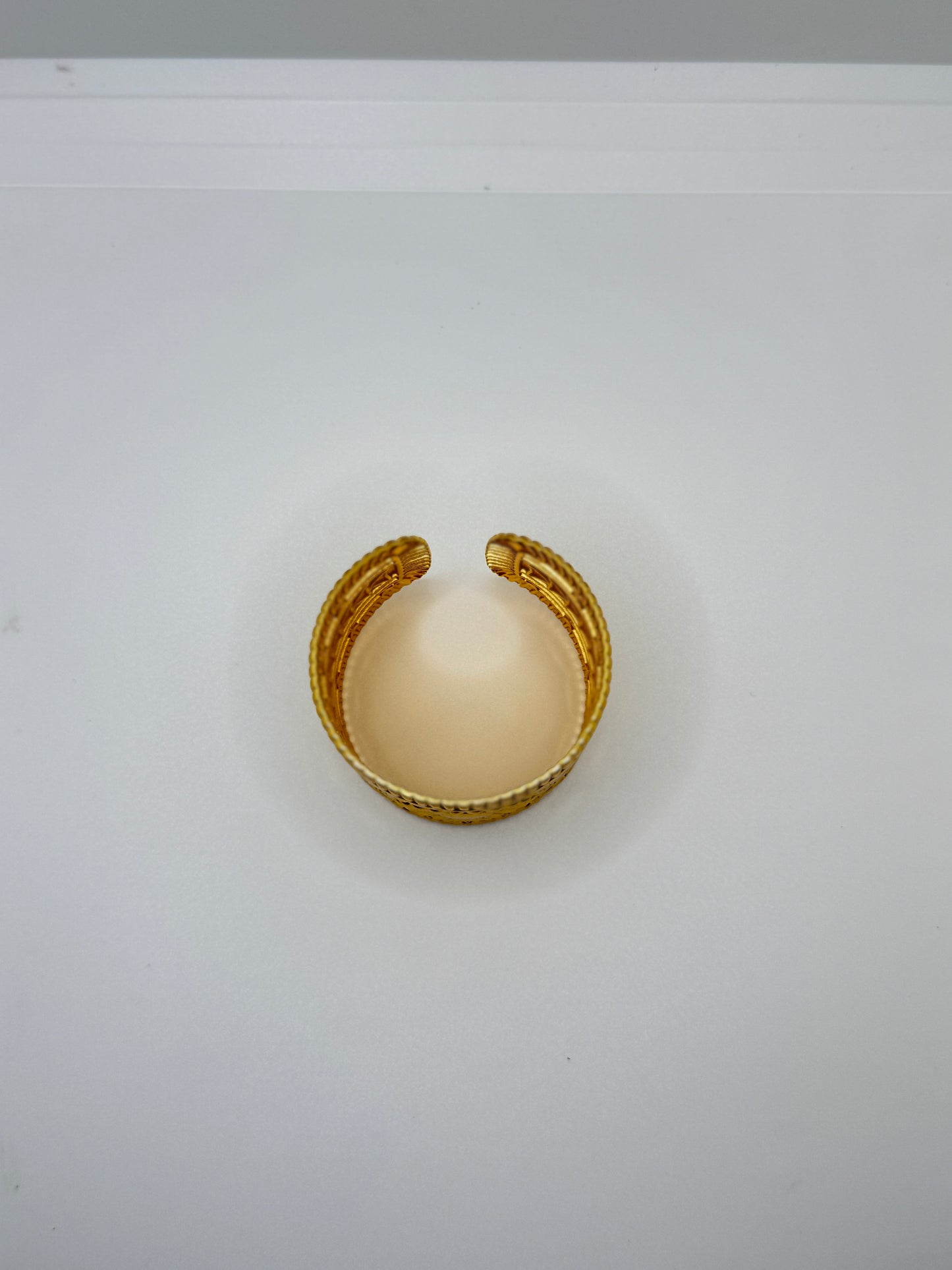 Wide Gold Cuff Bracelet with Embossed Medallion Pattern