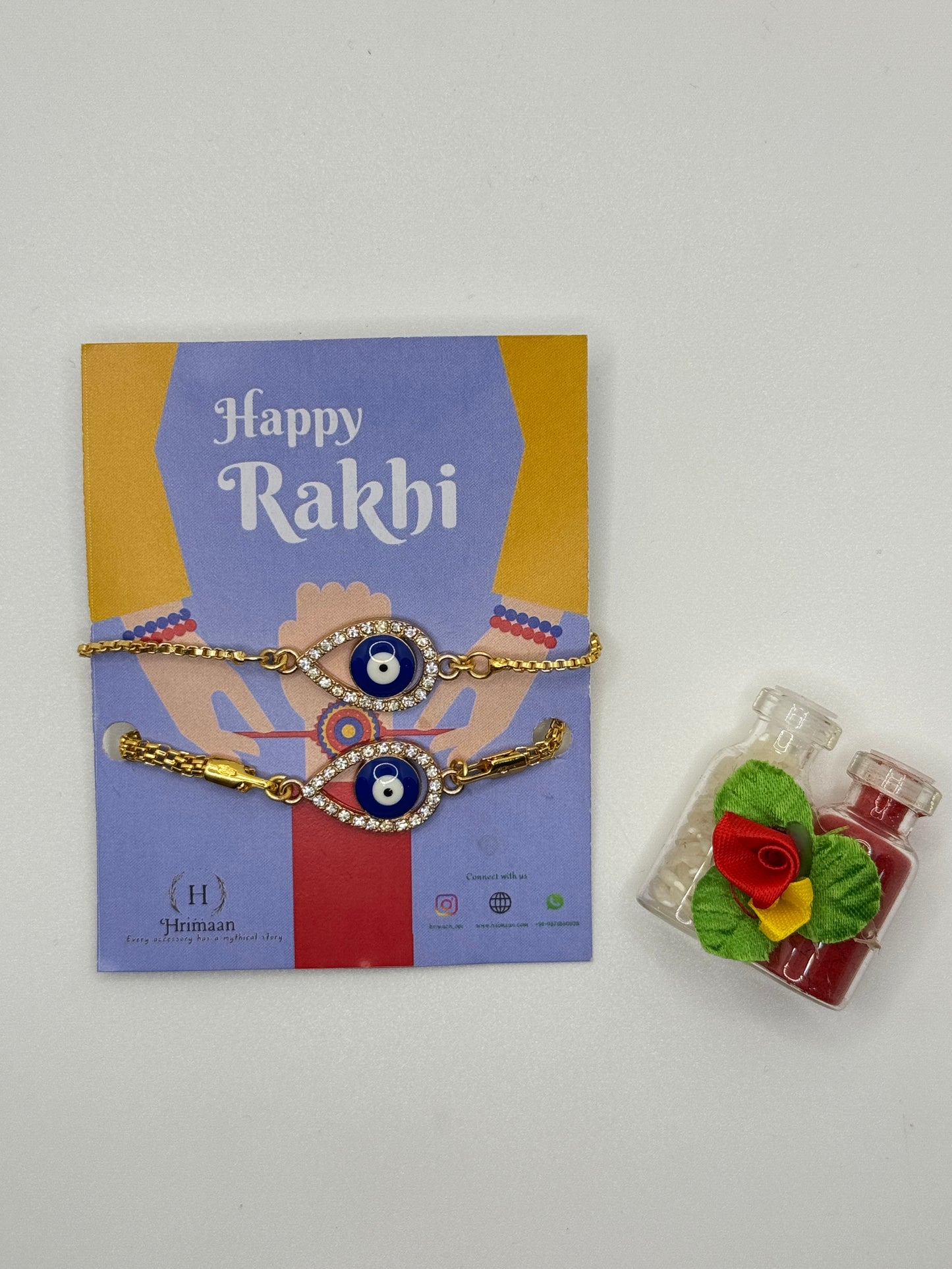 Evil Eye Duo Charm Rakhi for Bhaiya bhabhi  with kumkum and rice– Gold-Toned Protection Set