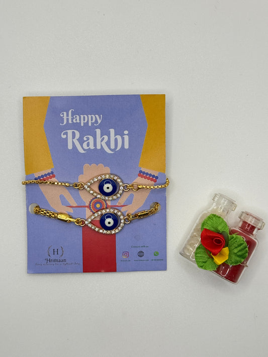 Evil Eye Duo Charm Rakhi for Bhaiya bhabhi  with kumkum and rice– Gold-Toned Protection Set