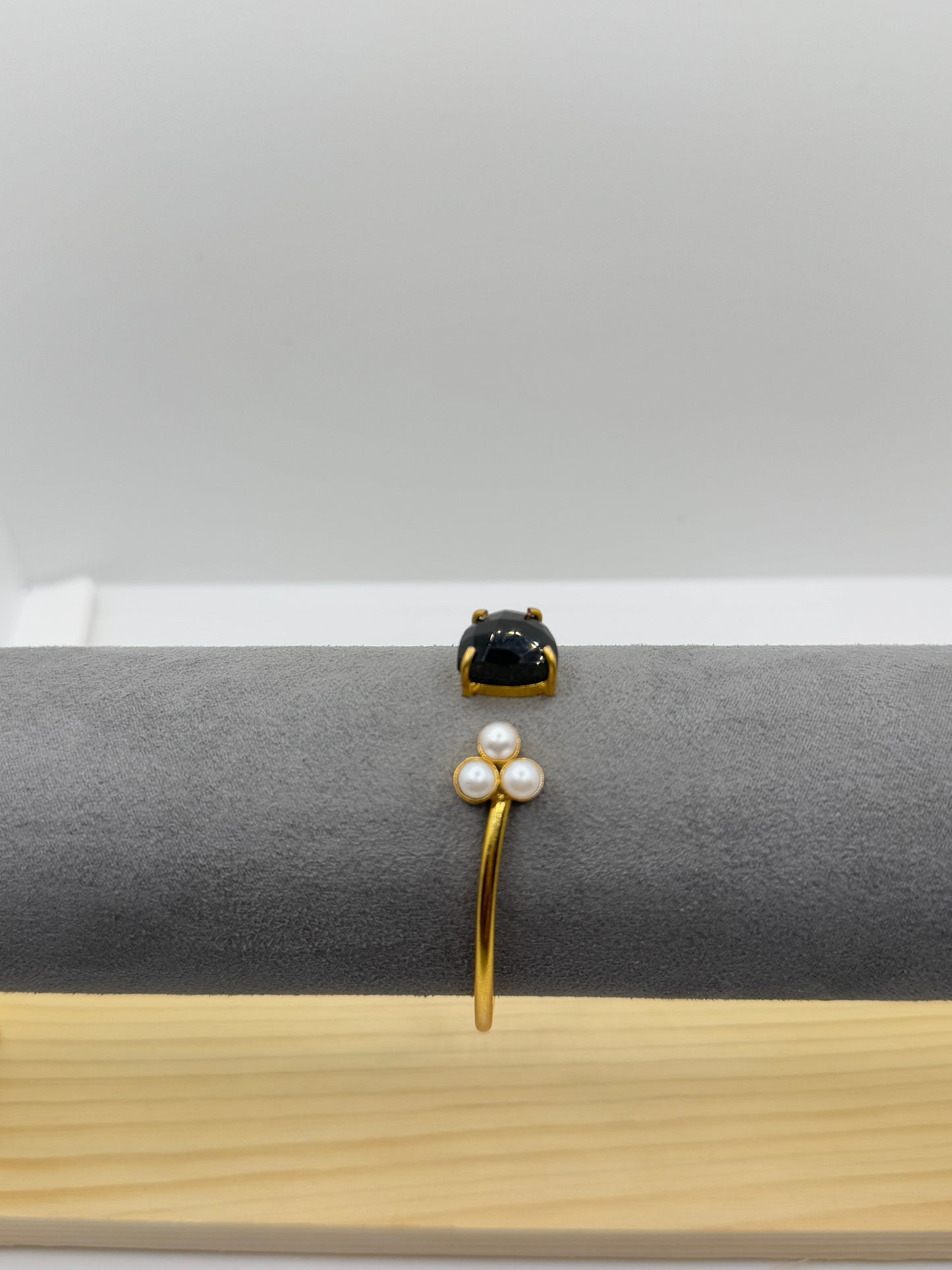 Open Gold Bangle with Black Teardrop Stone and Pearls