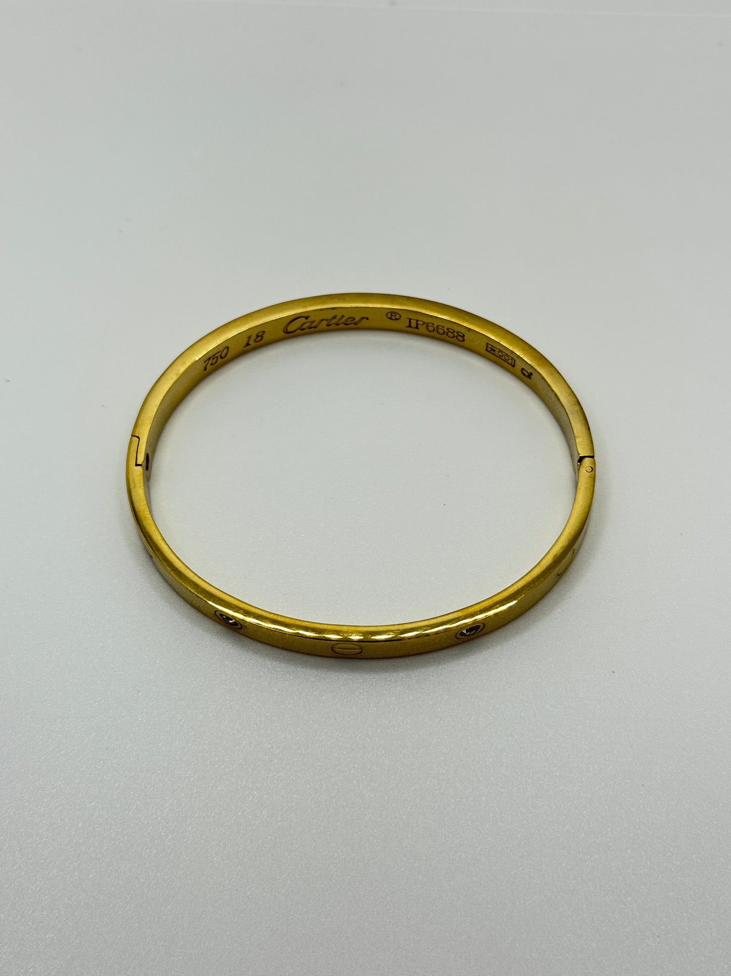 Gold Tone Screw Detail Bangle with Crystals