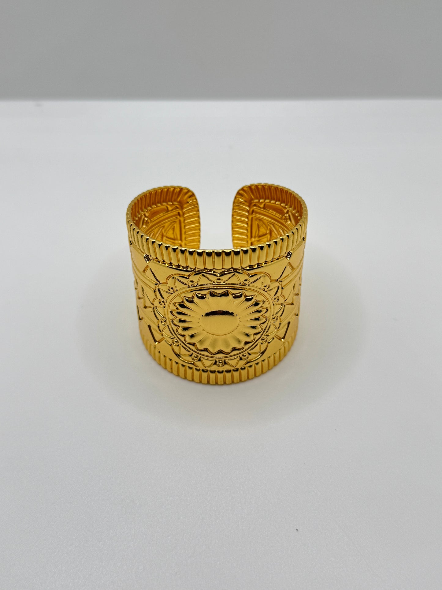 Wide Gold Cuff Bracelet with Embossed Medallion Pattern