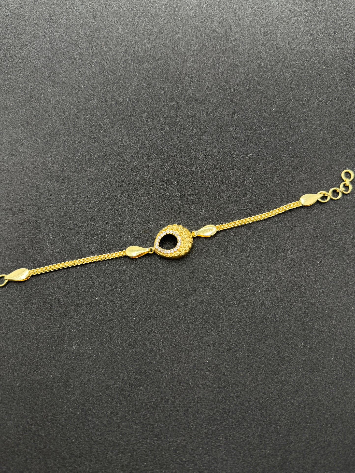 Ornate Gold Plated Rakhi with Stone Accents