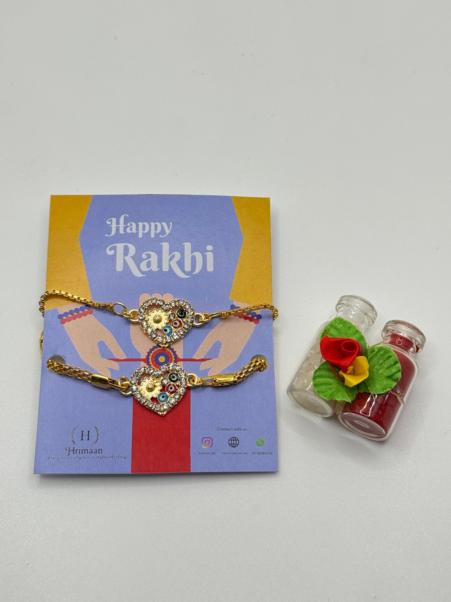 Evil Eye Duo Charm Rakhi for Bhaiya bhabhi  with kumkum and rice– Gold-Toned Protection Set