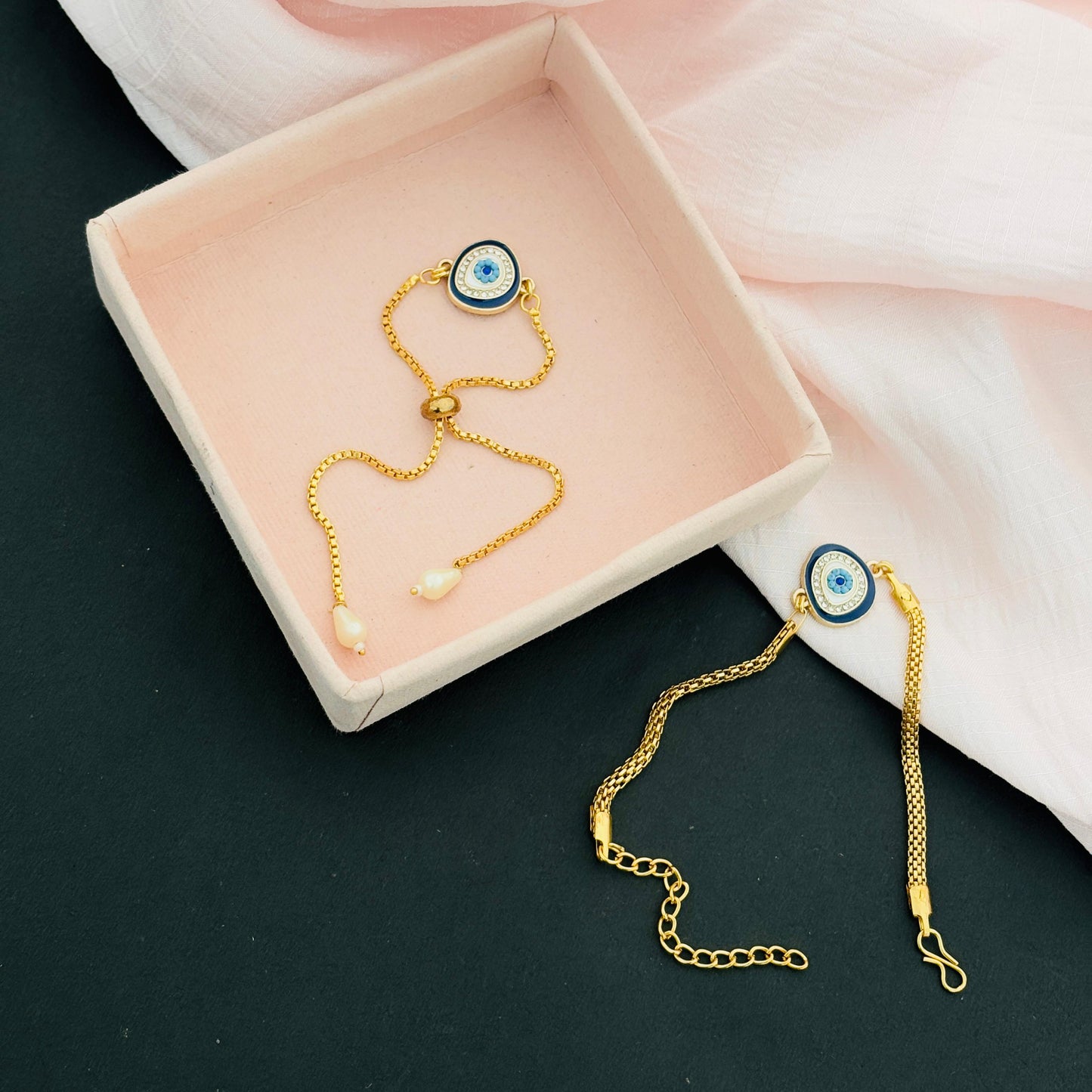 Evil Eye Duo Charm Rakhi for Bhaiya bhabhi  with kumkum and rice– Gold-Toned Protection Set