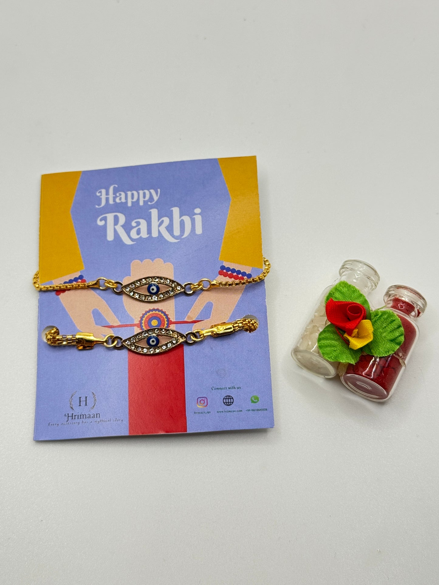 Evil Eye Duo Charm Rakhi for Bhaiya bhabhi  with kumkum and rice– Gold-Toned Protection Set