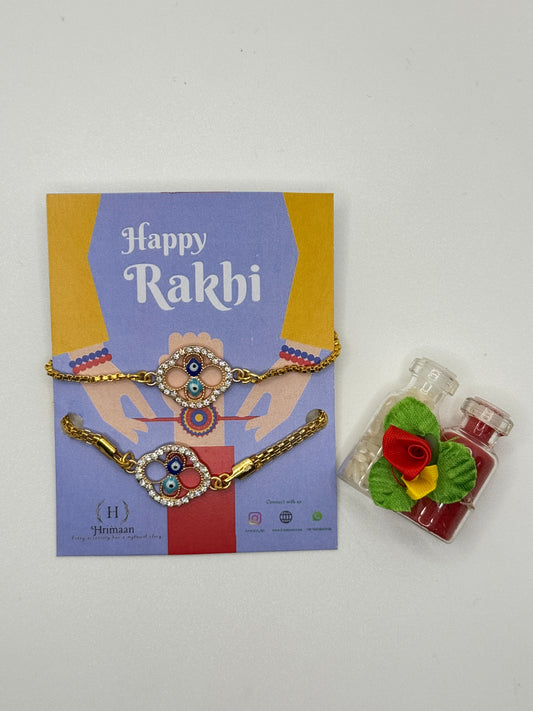 Evil Eye Duo Charm Rakhi for Bhaiya bhabhi  with kumkum and rice– Gold-Toned Protection Set