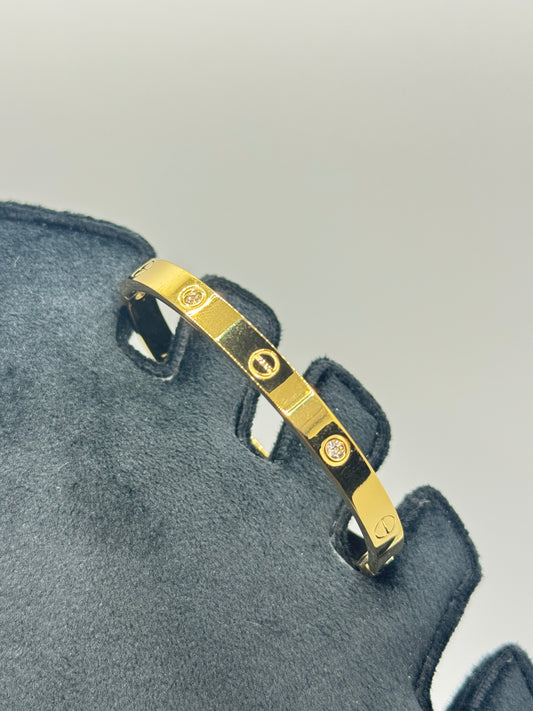 Gold Tone Screw Detail Bangle with Crystals