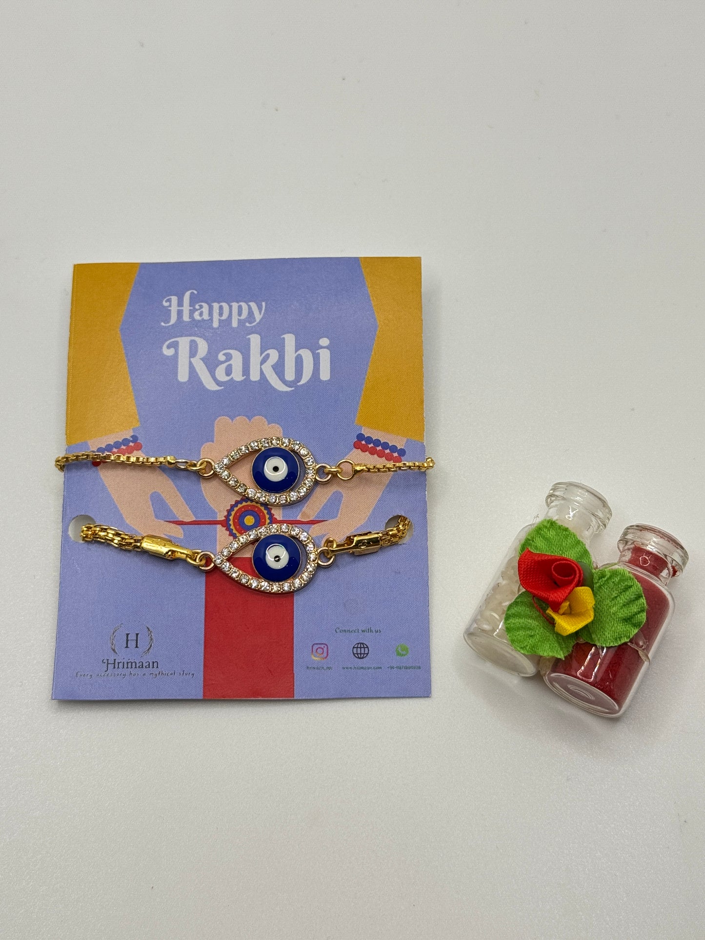 Evil Eye Duo Charm Rakhi for Bhaiya bhabhi  with kumkum and rice– Gold-Toned Protection Set