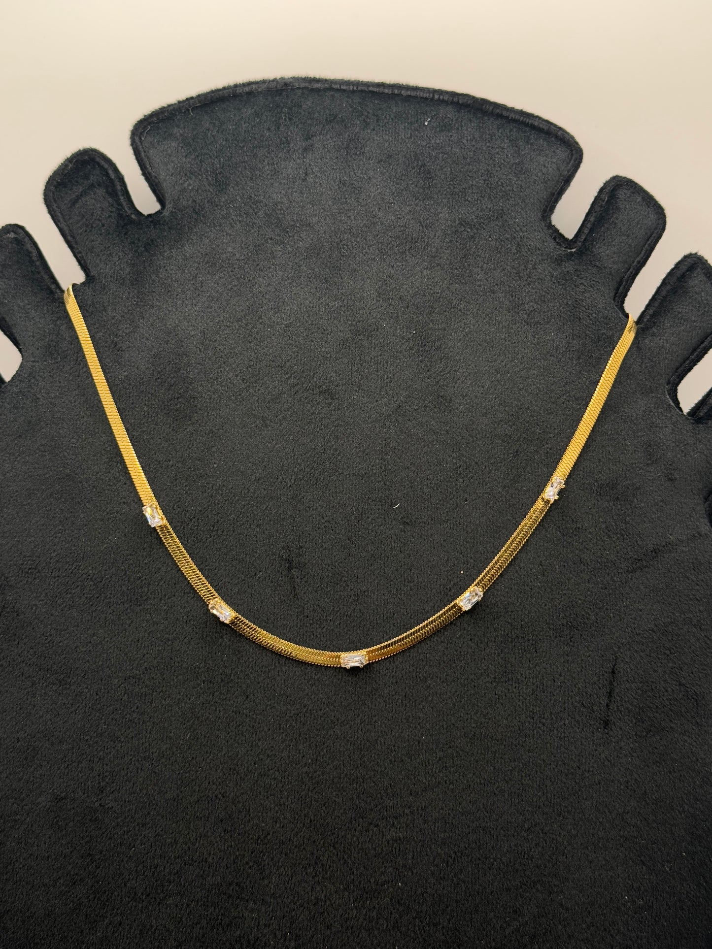Glimmering Gold Snake Chain Necklace with Cubic Zirconia Stations