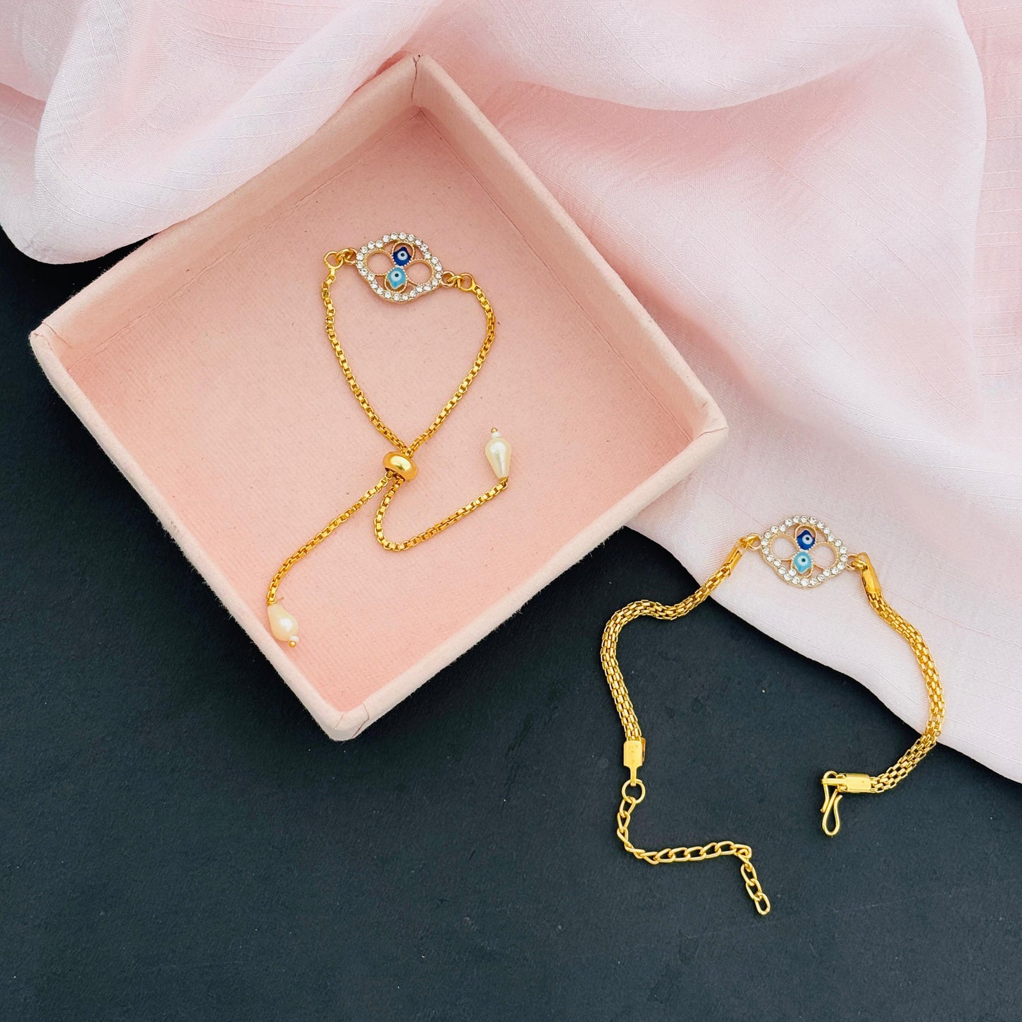 Evil Eye Duo Charm Rakhi for Bhaiya bhabhi  with kumkum and rice– Gold-Toned Protection Set