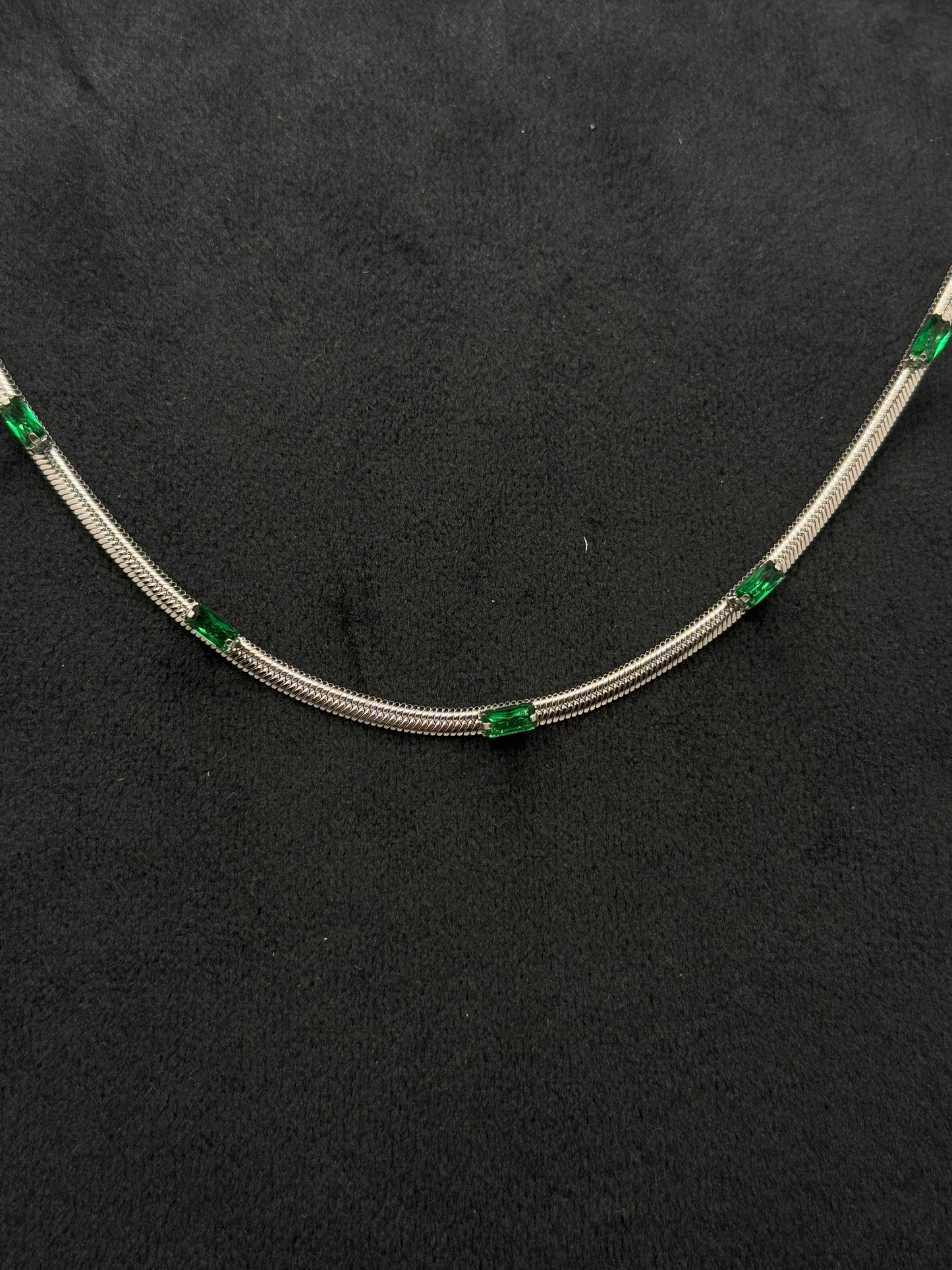 Elegant Silver Tone Snake Chain Necklace with Emerald Green Baguette Accents