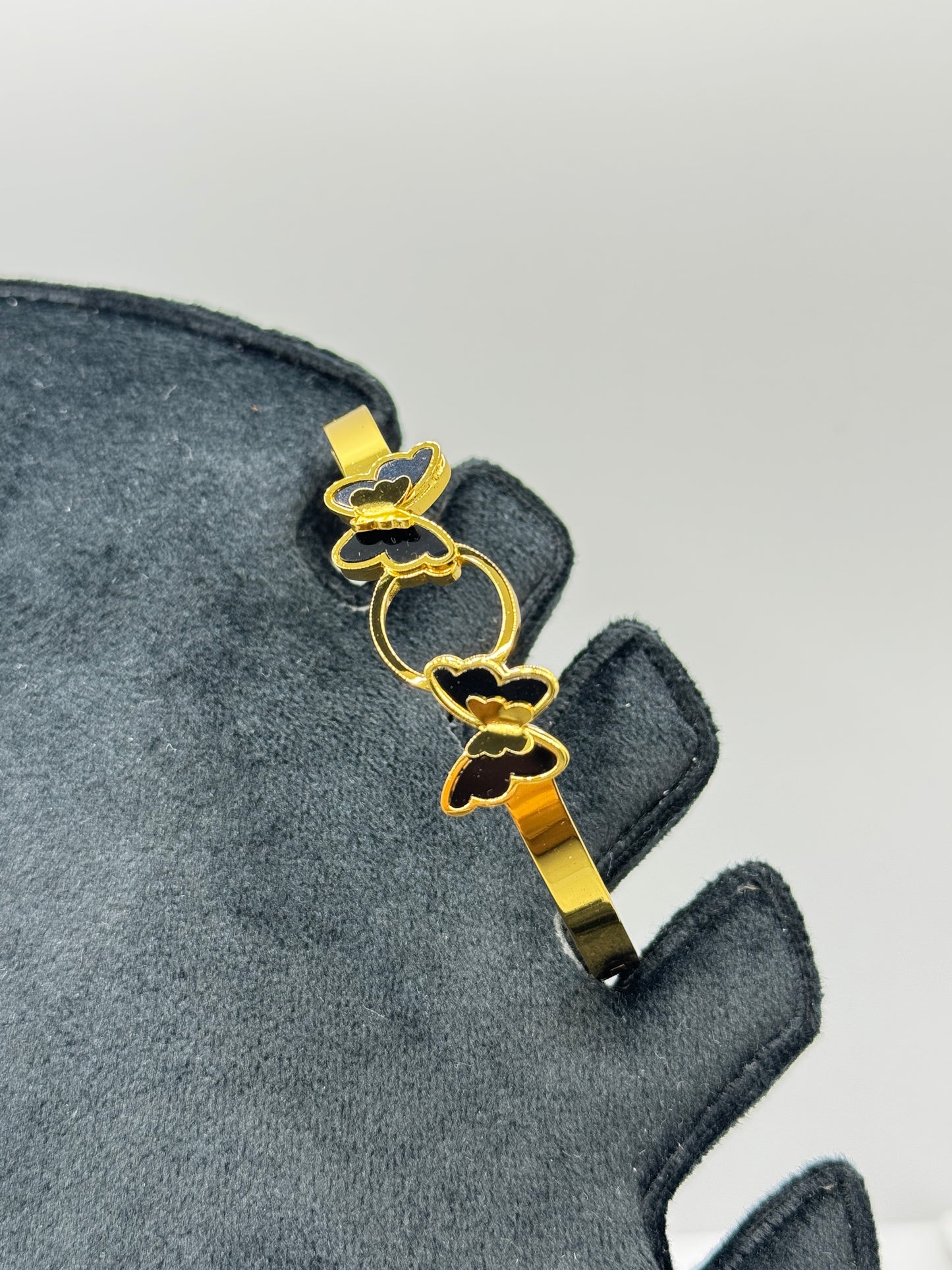 Gold Bangle with Black Butterfly Accents