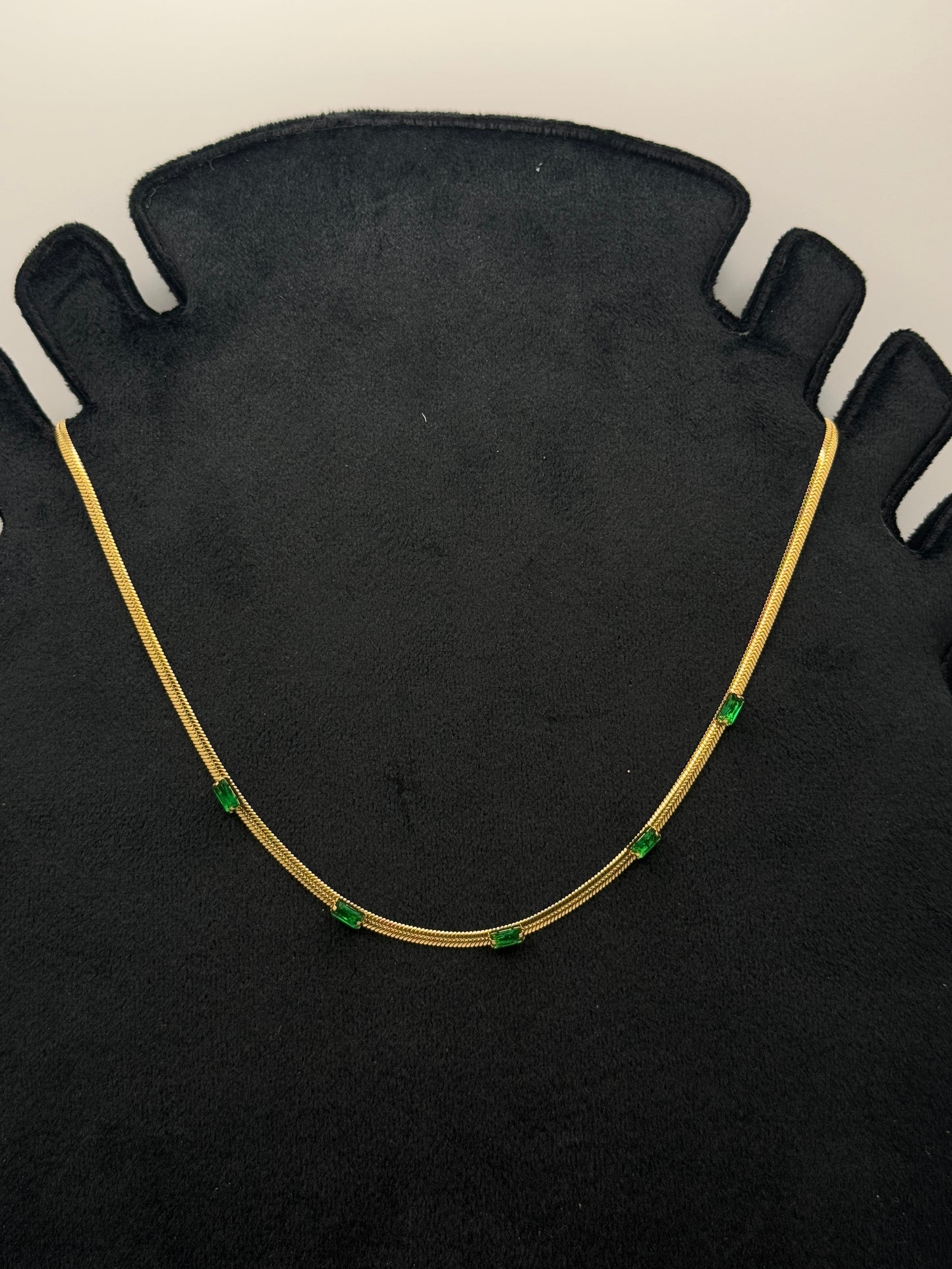 Gold Tone Snake Chain Necklace with Emerald Green Baguette Accents