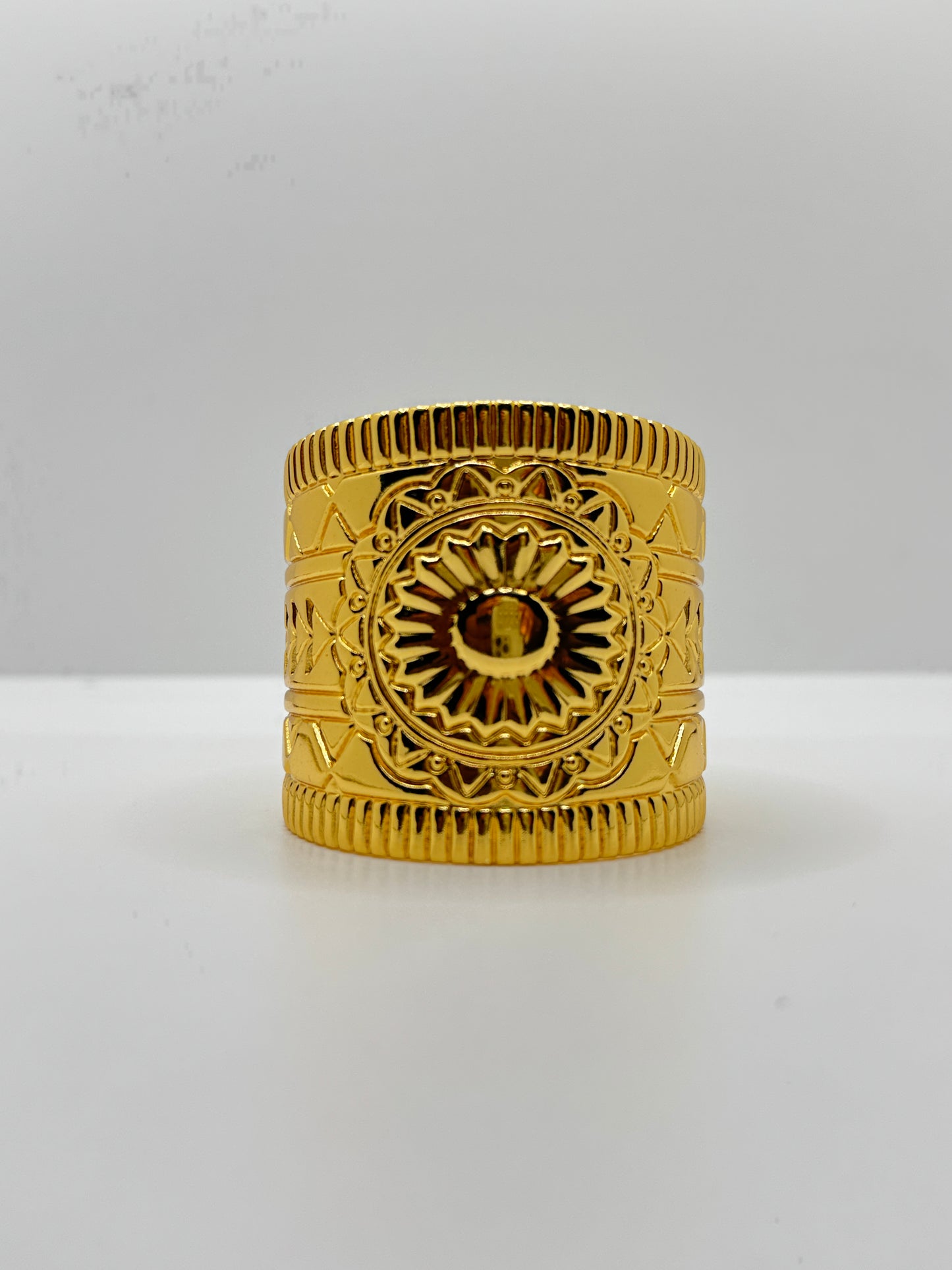 Wide Gold Cuff Bracelet with Embossed Medallion Pattern