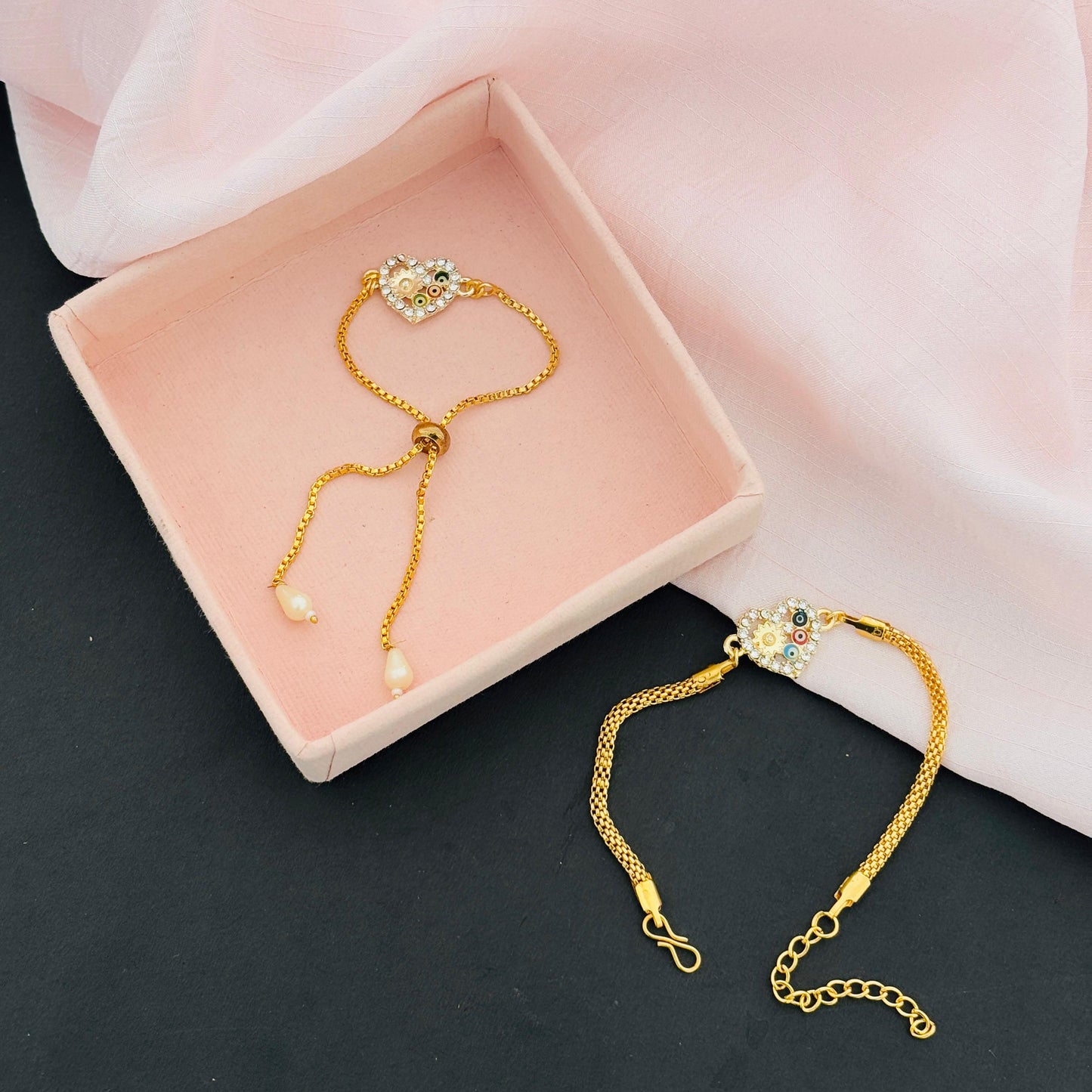Evil Eye Duo Charm Rakhi for Bhaiya bhabhi  with kumkum and rice– Gold-Toned Protection Set