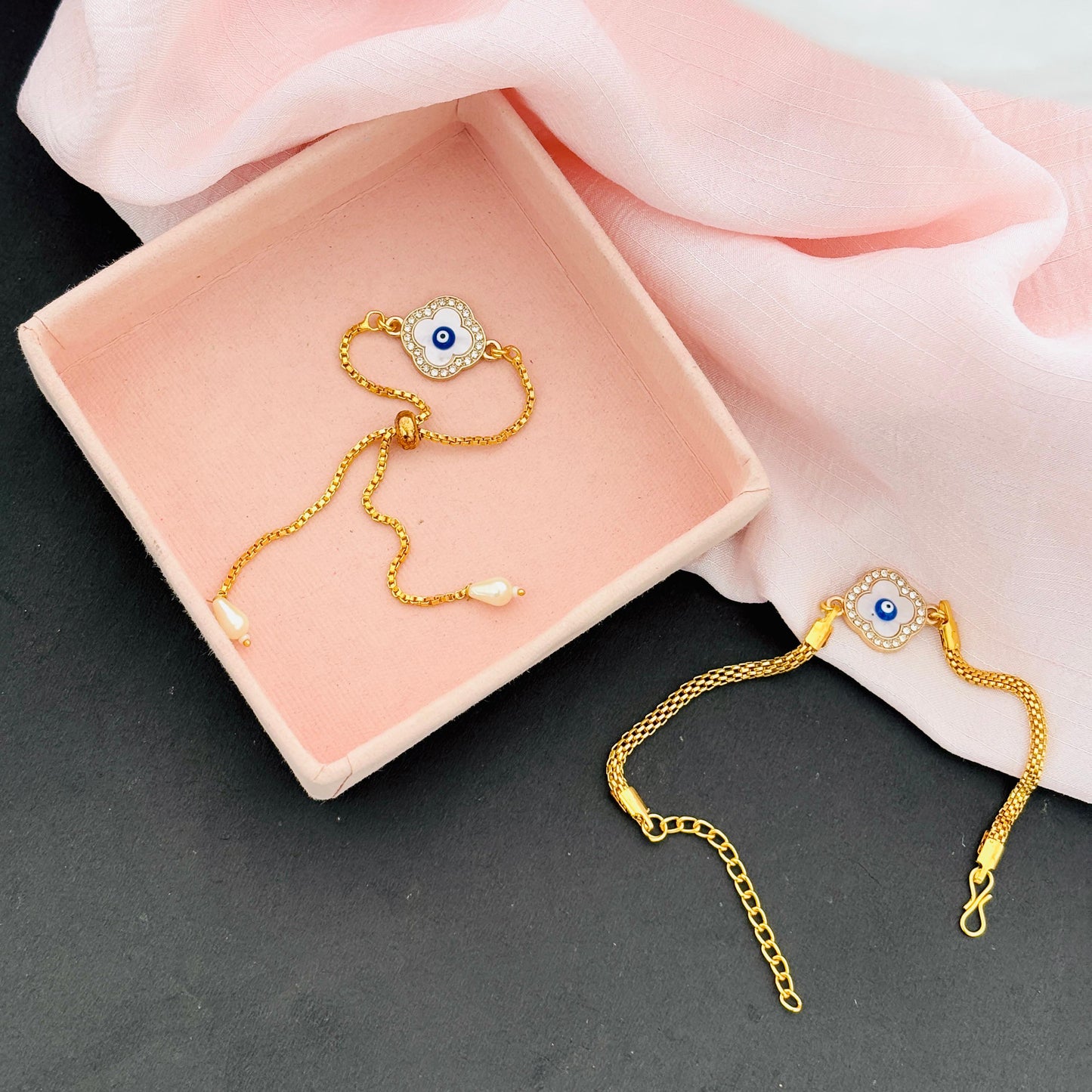 Evil Eye Duo Charm Rakhi for Bhaiya bhabhi  with kumkum and rice– Gold-Toned Protection Set