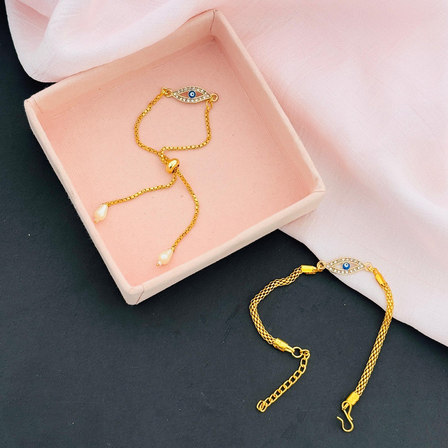 Evil Eye Duo Charm Rakhi for Bhaiya bhabhi  with kumkum and rice– Gold-Toned Protection Set