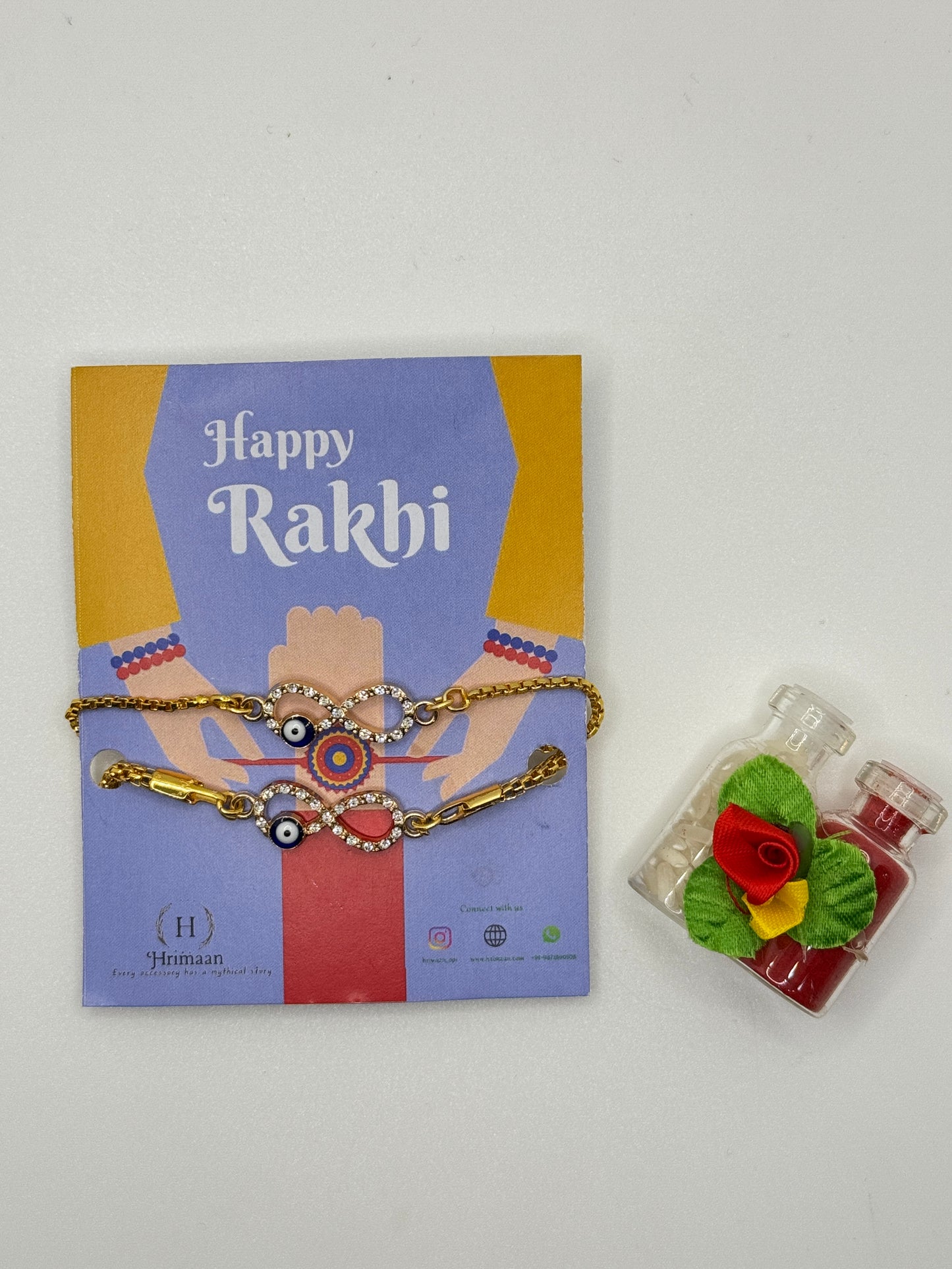 Evil Eye Duo Charm Rakhi for Bhaiya bhabhi  with kumkum and rice– Gold-Toned Protection Set