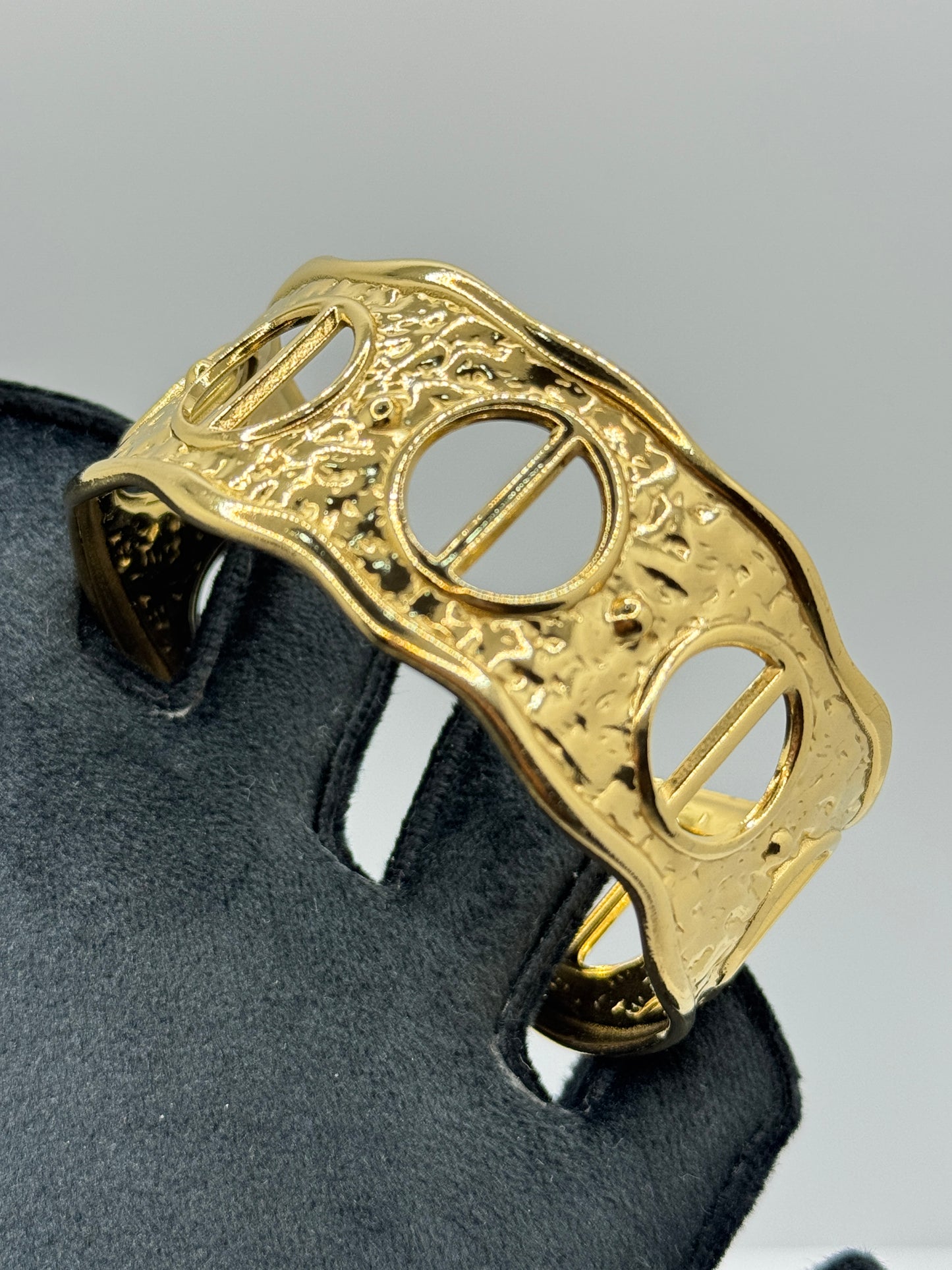 Ornate Gold Cuff Bracelet with Circular Cut-Outs